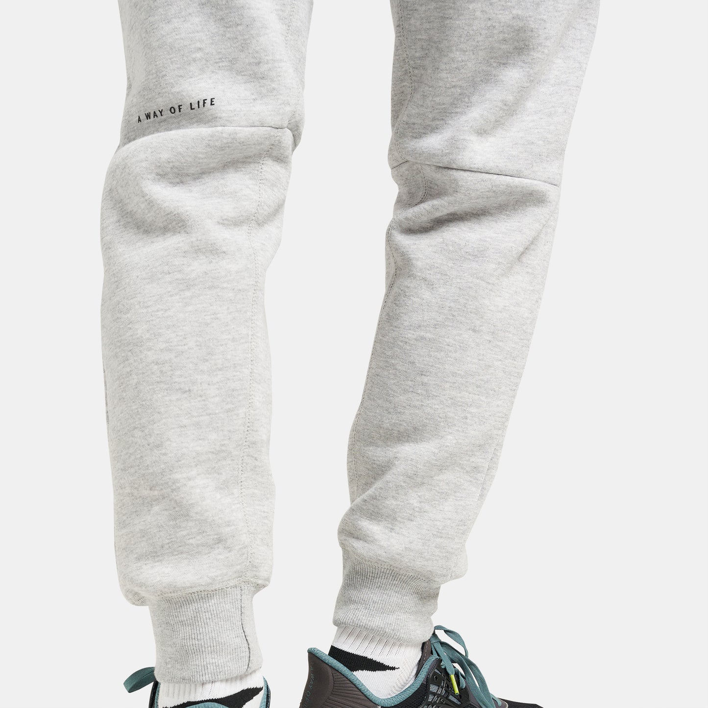 Light gray sweatpants with a snug fit and a motivational phrase designed for casual wear and comfort