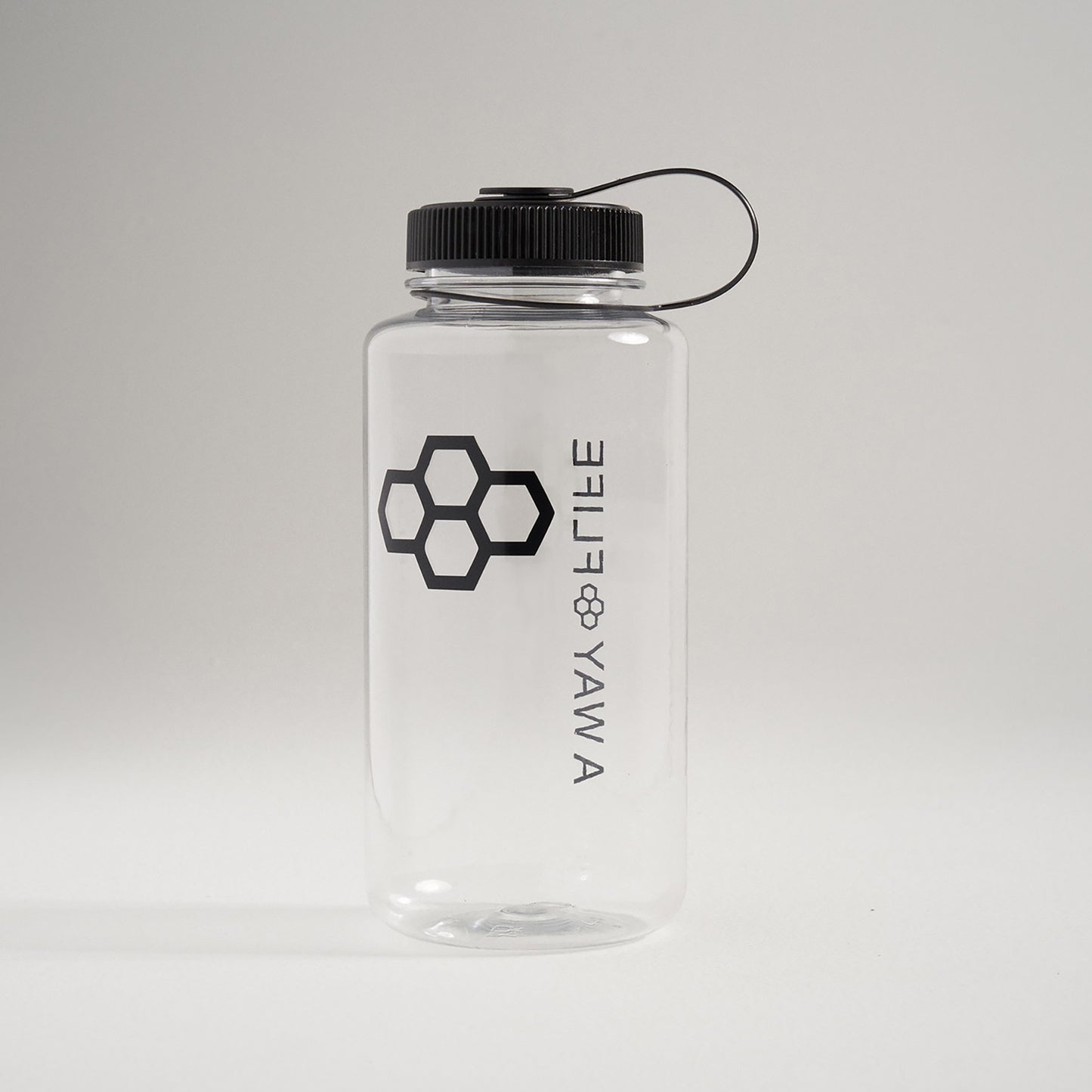 A clear plastic water bottle with a black screw-on lid and a geometric logo design featuring hexagons on the side