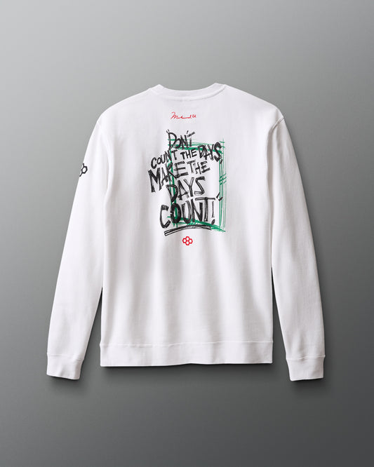 White sweatshirt with text and graphics on the back against a gray background "Don't count the days, make the days count!" Muhammad Ali