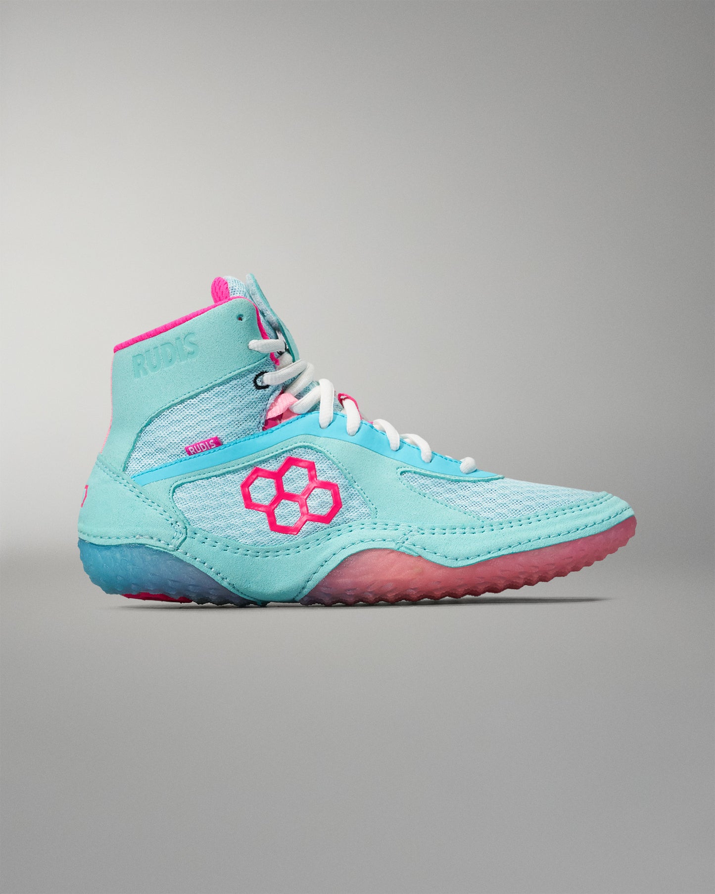 Light blue and pink wrestling shoe on a gray background