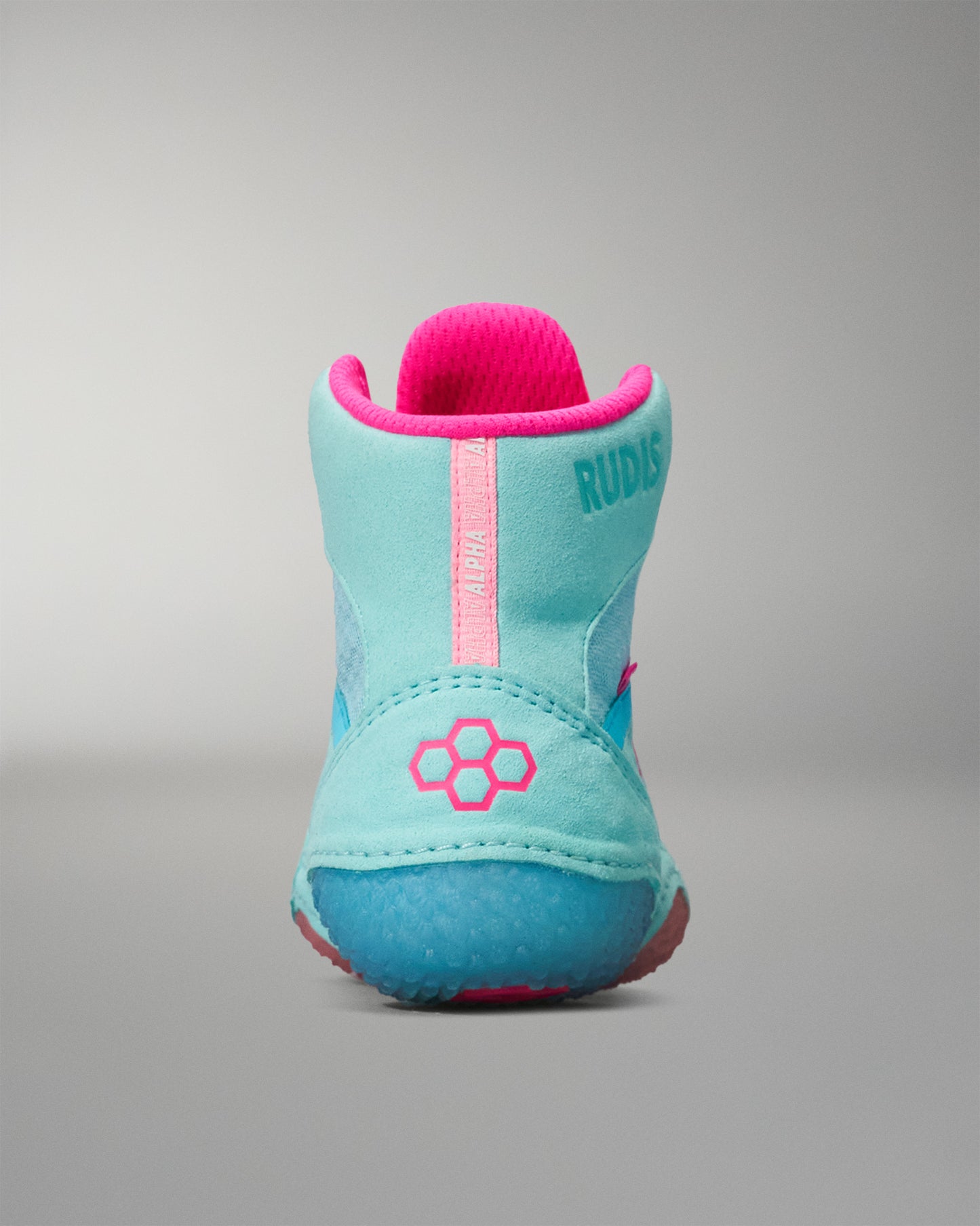Turquoise and pink Wrestling Shoe on a gray background