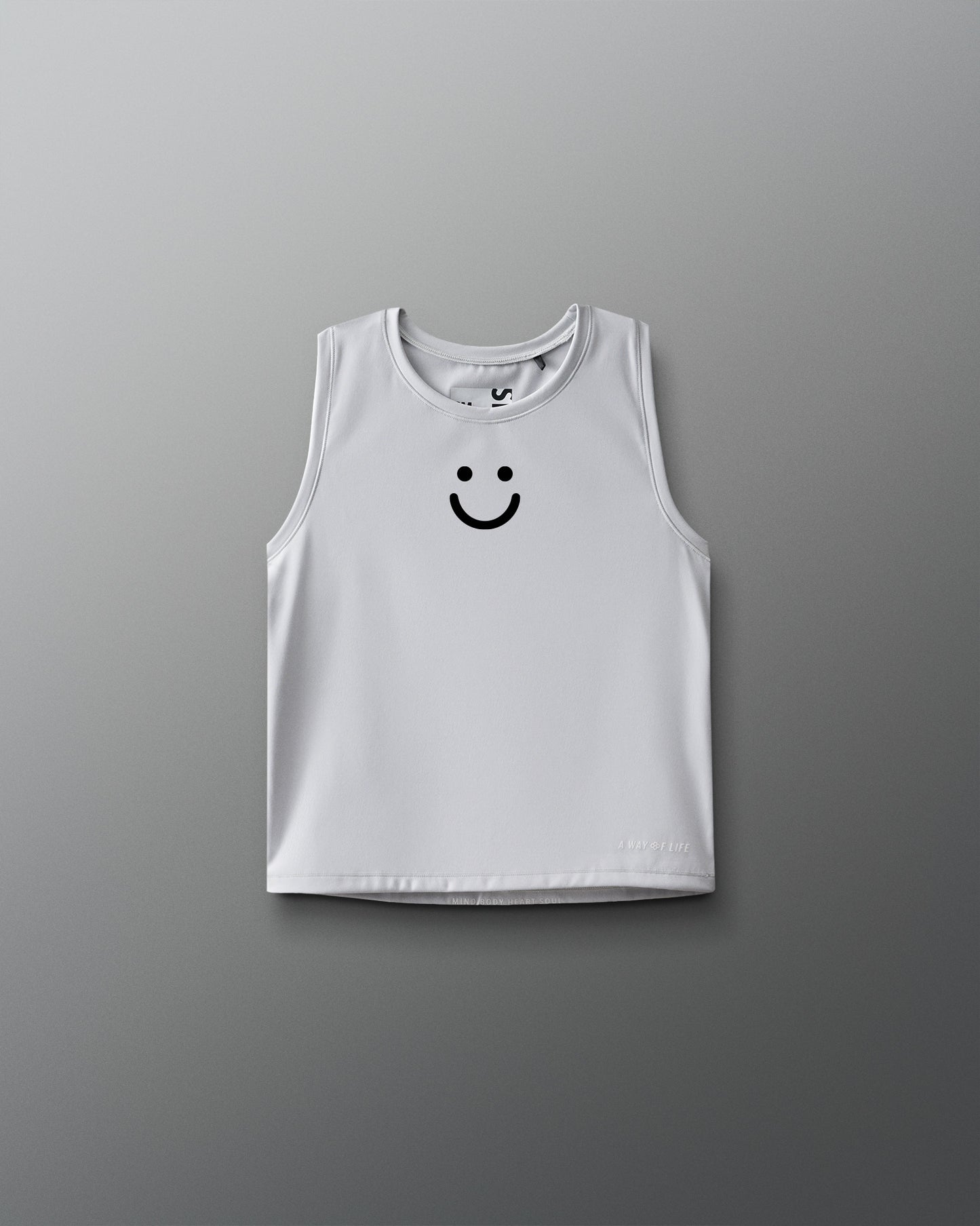 White tank top with a smiley face design on a gray background