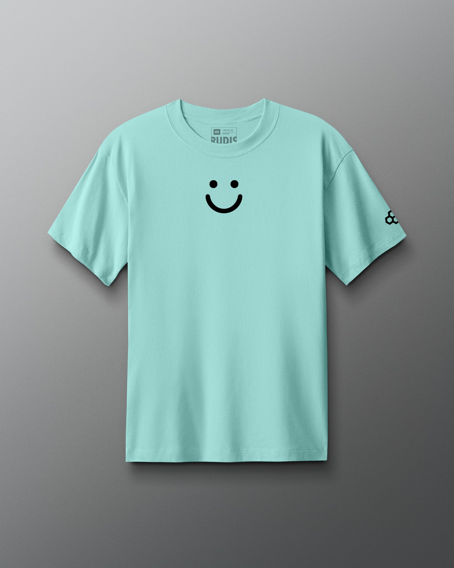 Light blue t-shirt with a smiley face design on a gray background