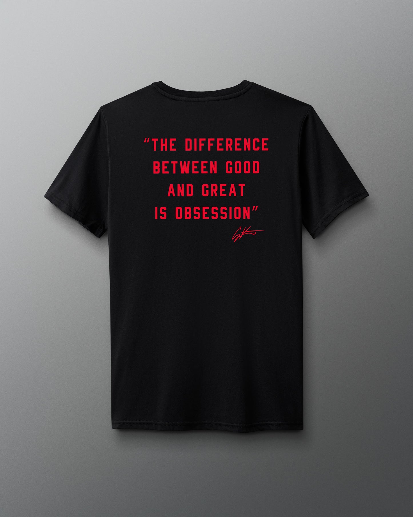 Black t-shirt with red 'The difference between good and great is obsession' text on a gray background