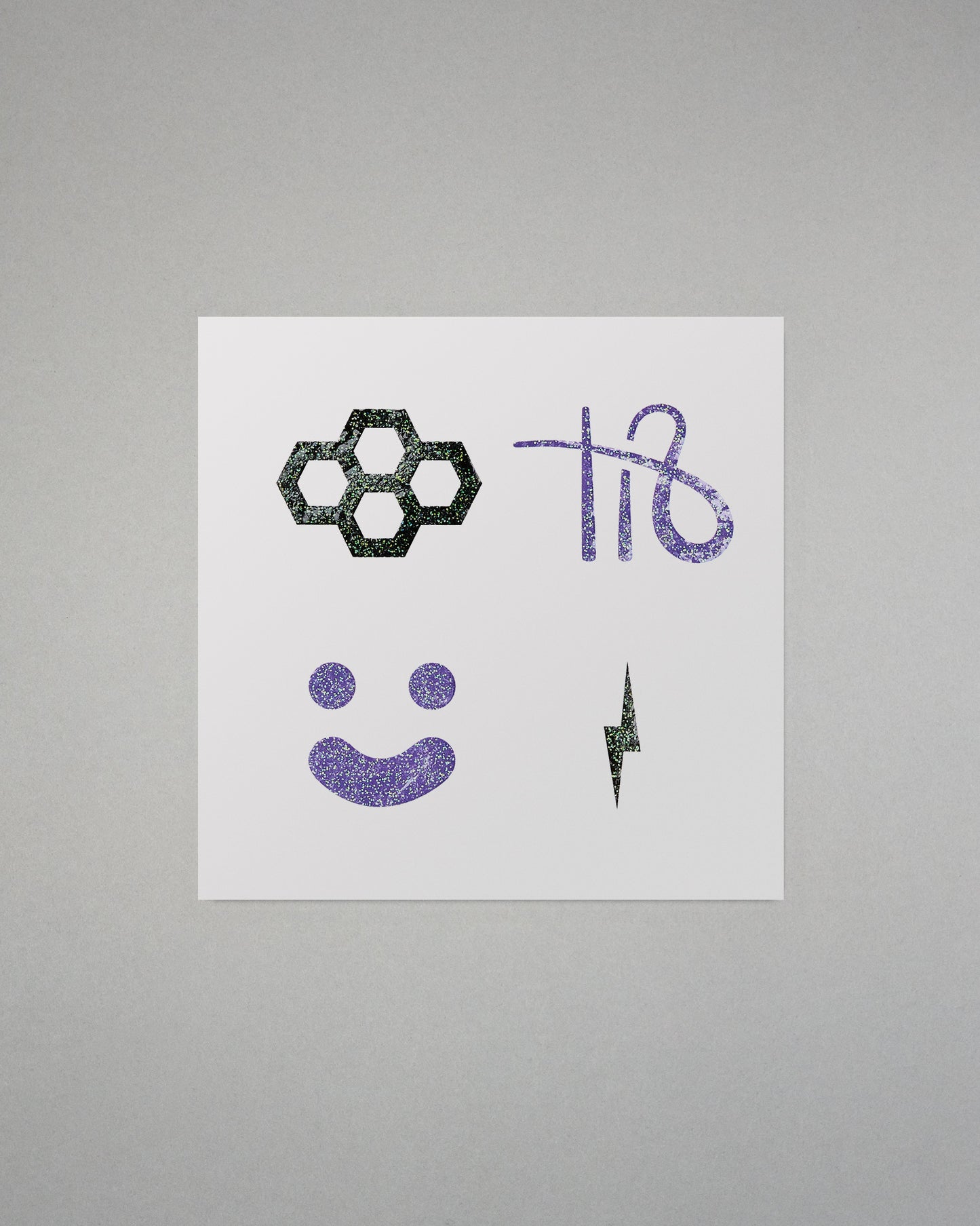 White paper with black and purple symbols on a gray background