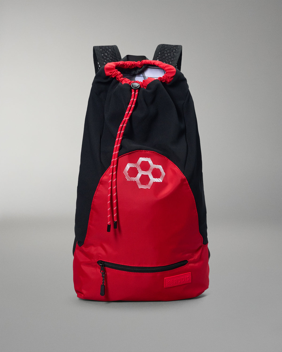 Black and red backpack with a geometric design on a gray background