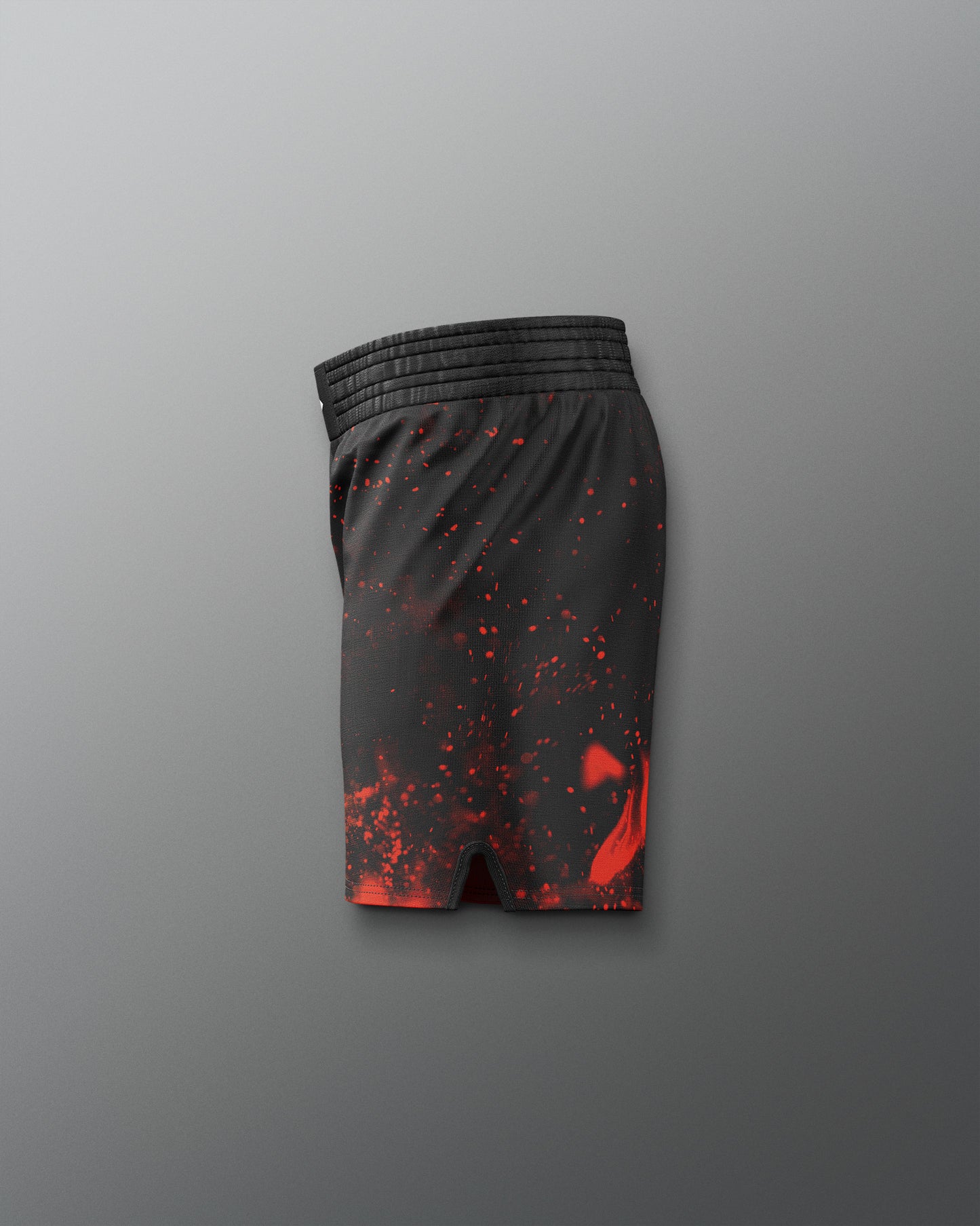 Black shorts with red splatter pattern on a gray background
