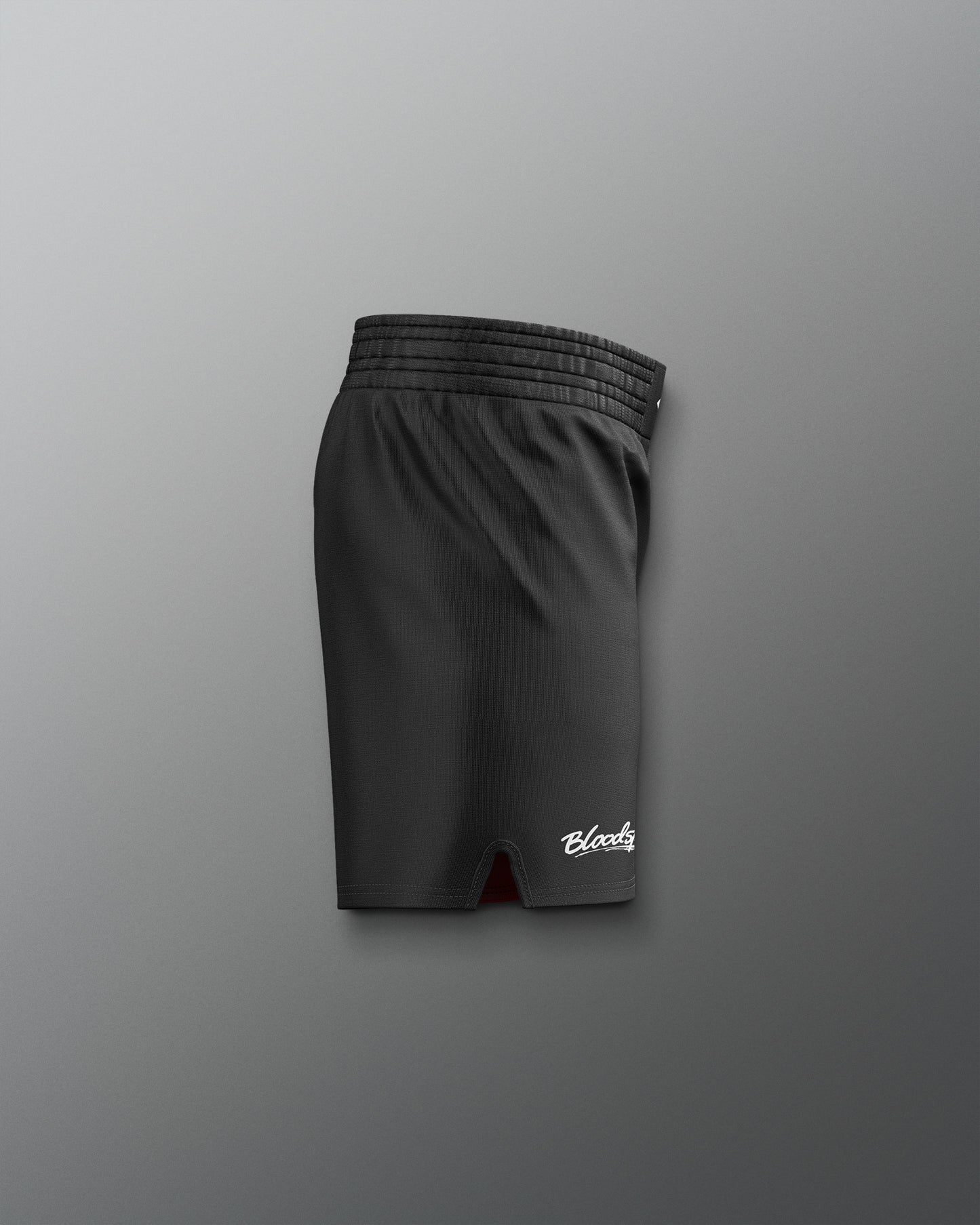 Black shorts with a brand logo on a gray background