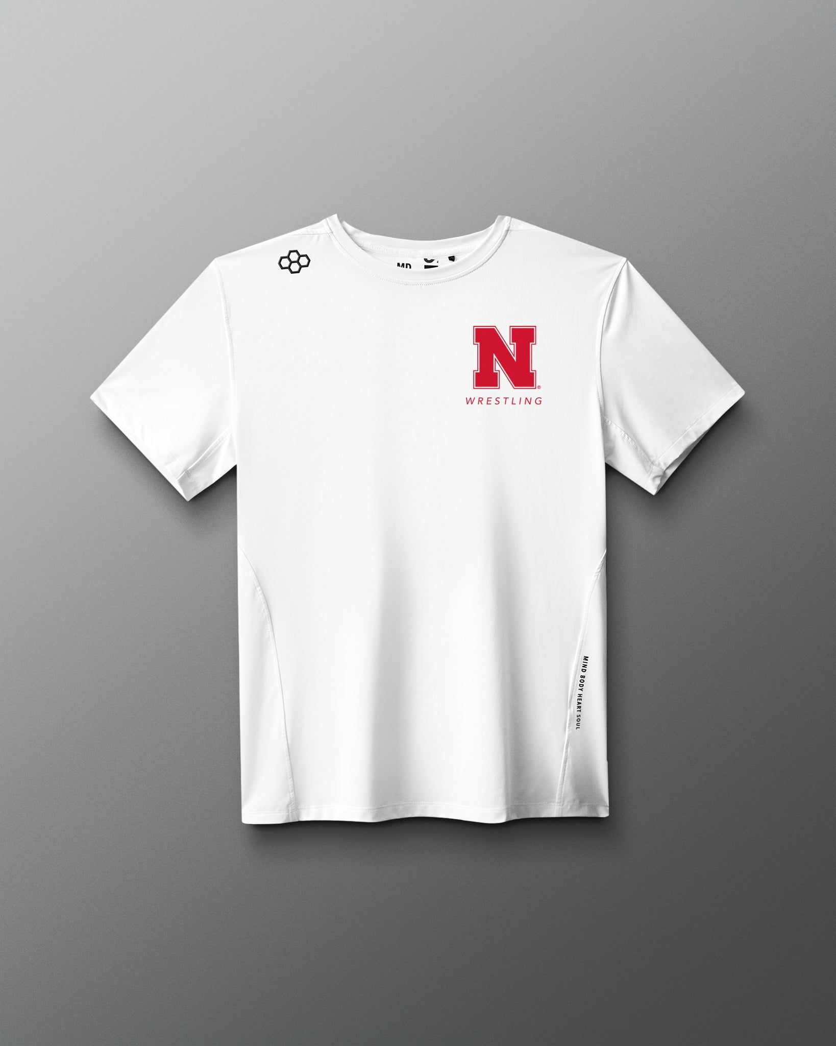 White t-shirt with red logo on a gray background. Nebraska