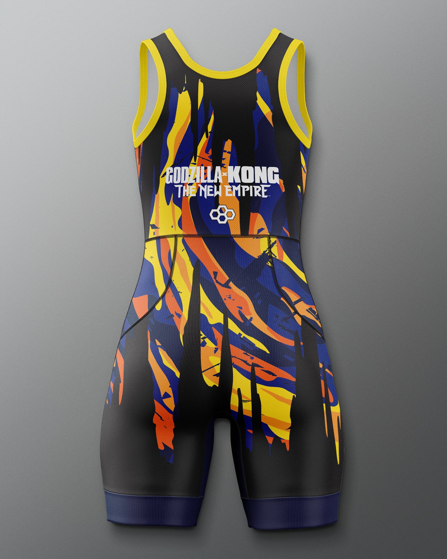 A sleeveless Gorilla Kong: The New Empire athletic singlet with a black base and a bold abstract pattern of yellow, orange, and blue, shown on a neutral gray background.