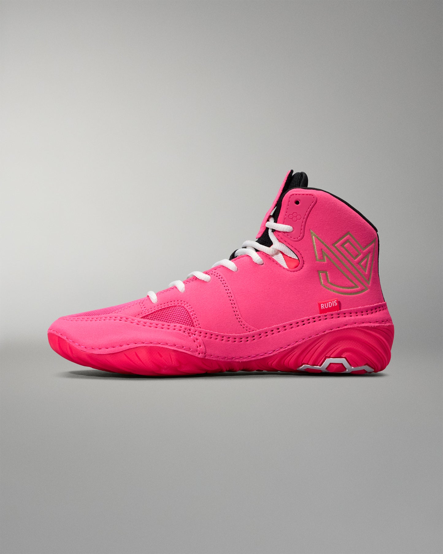 Pink high-top wrestling shoe on a gray background