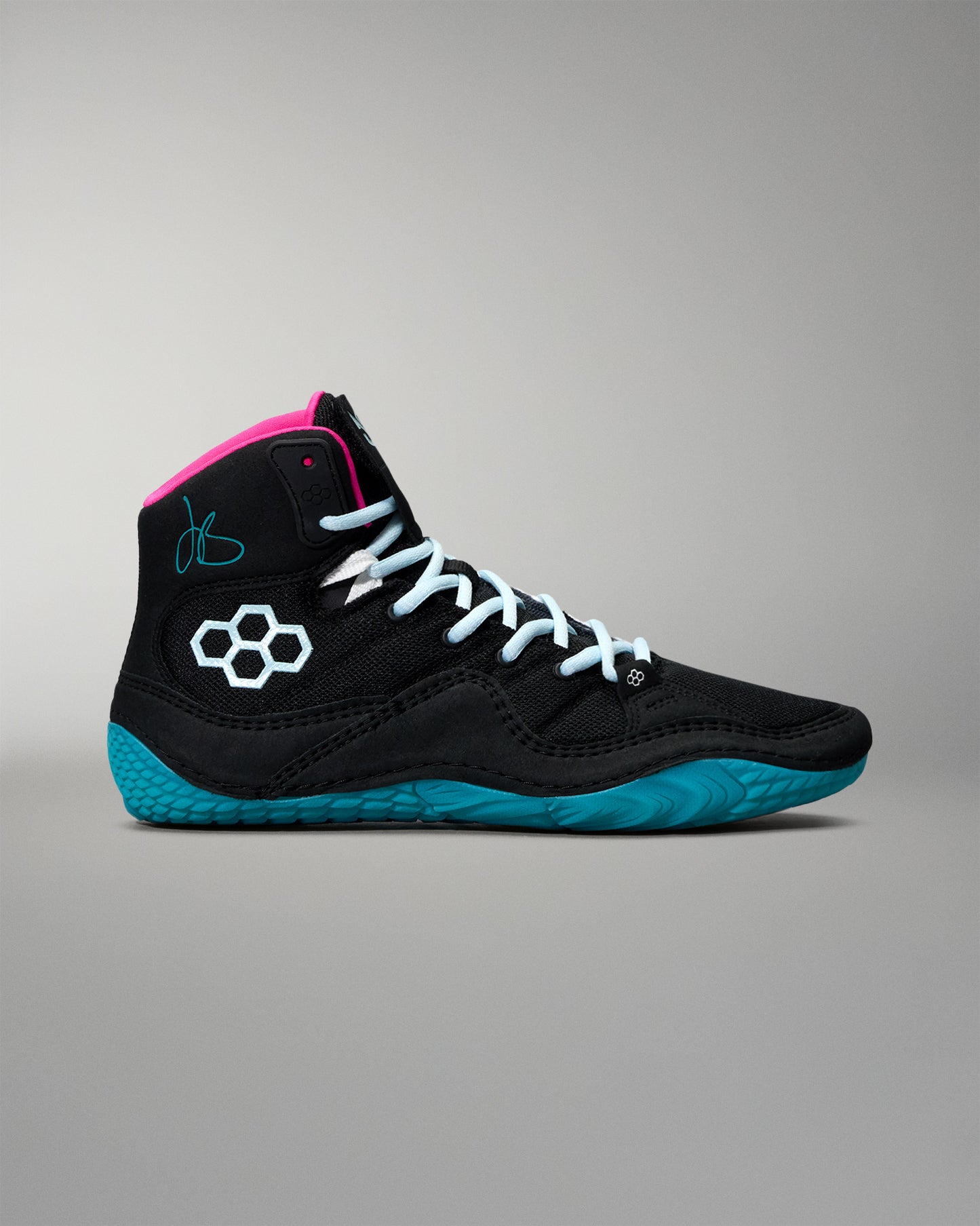 Black high-top wrestling shoe with blue sole and pink interior on a gray background