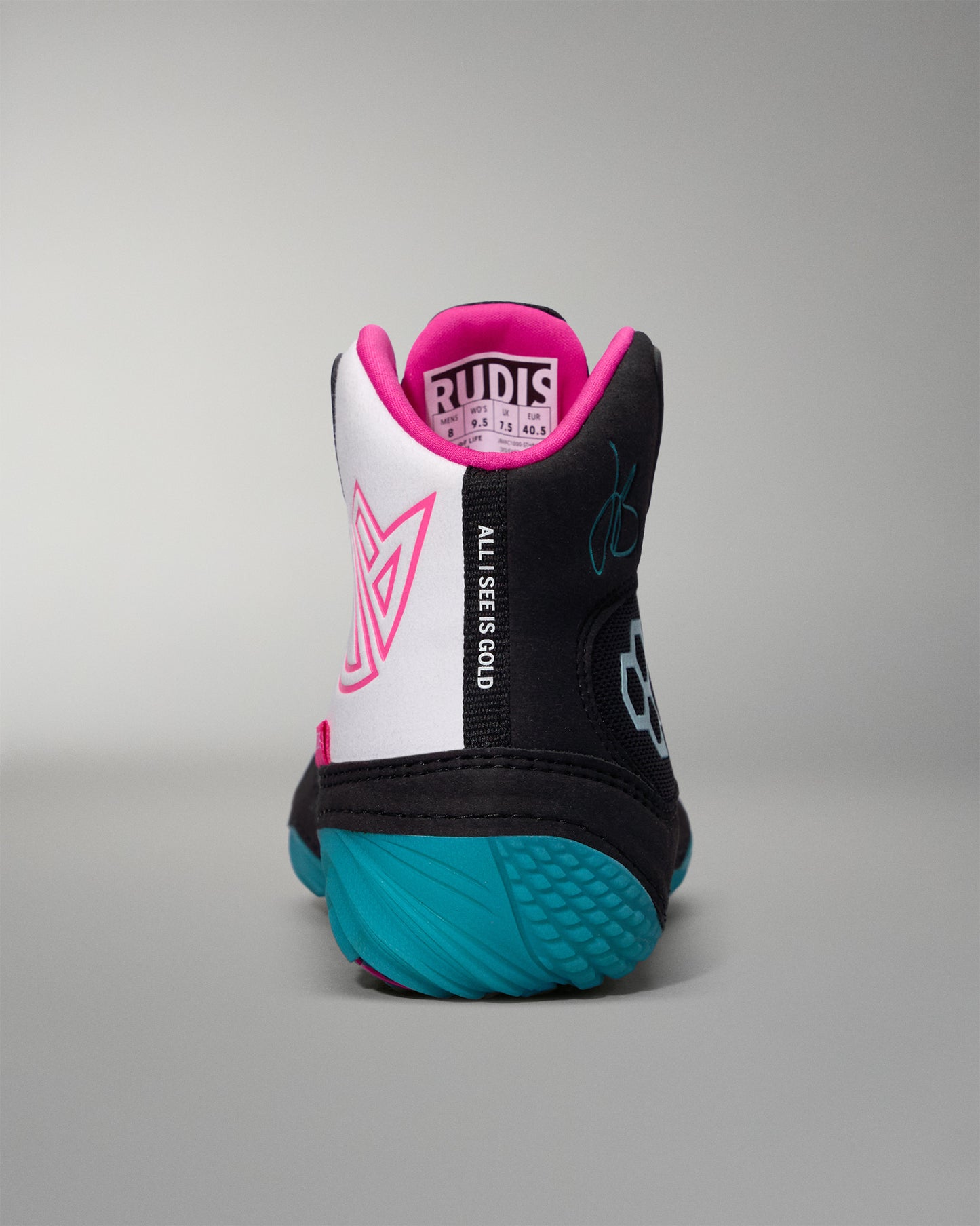 Back view of a wrestling shoe with black, white, and teal design on a gray background