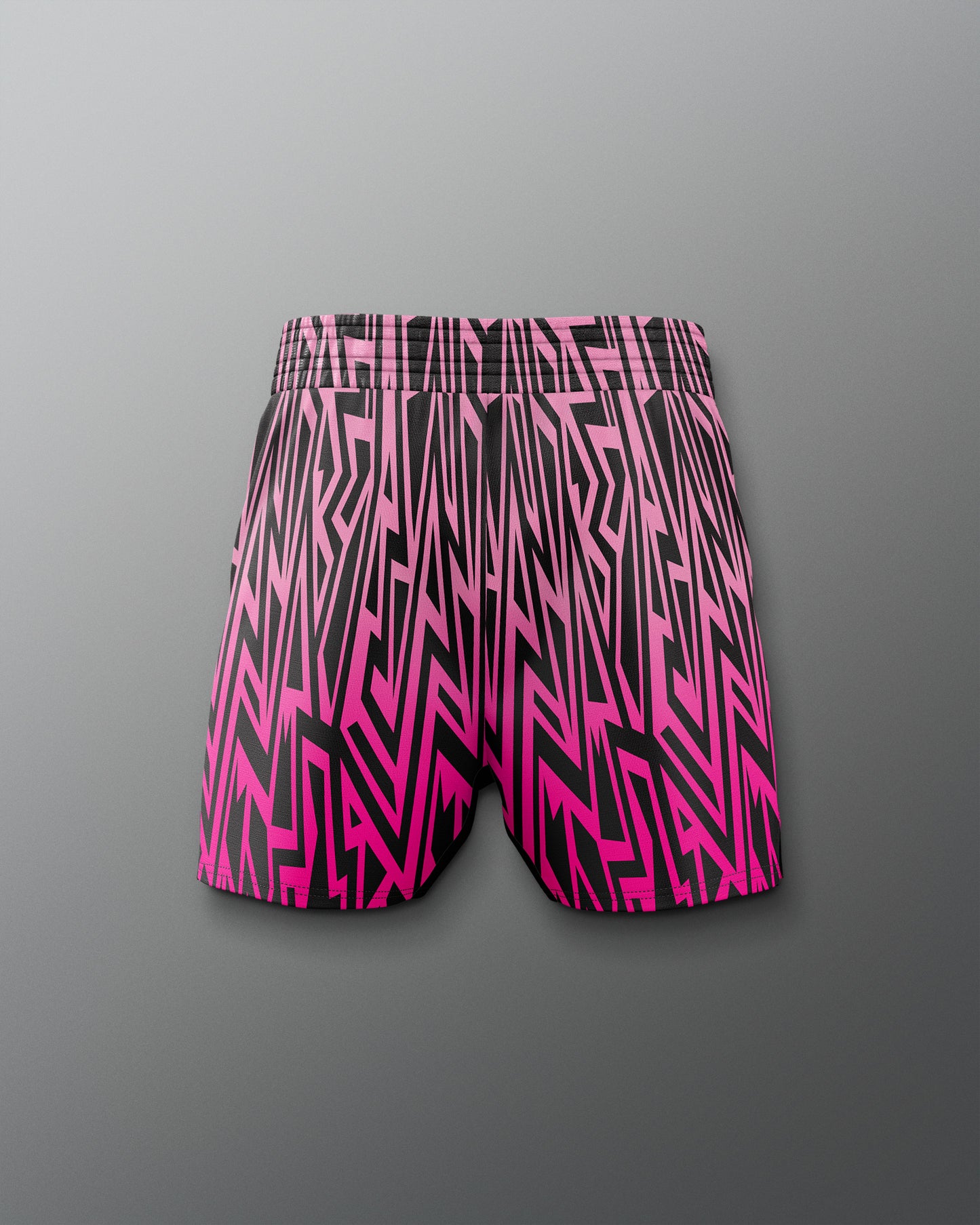Pink and black patterned shorts on a gray background