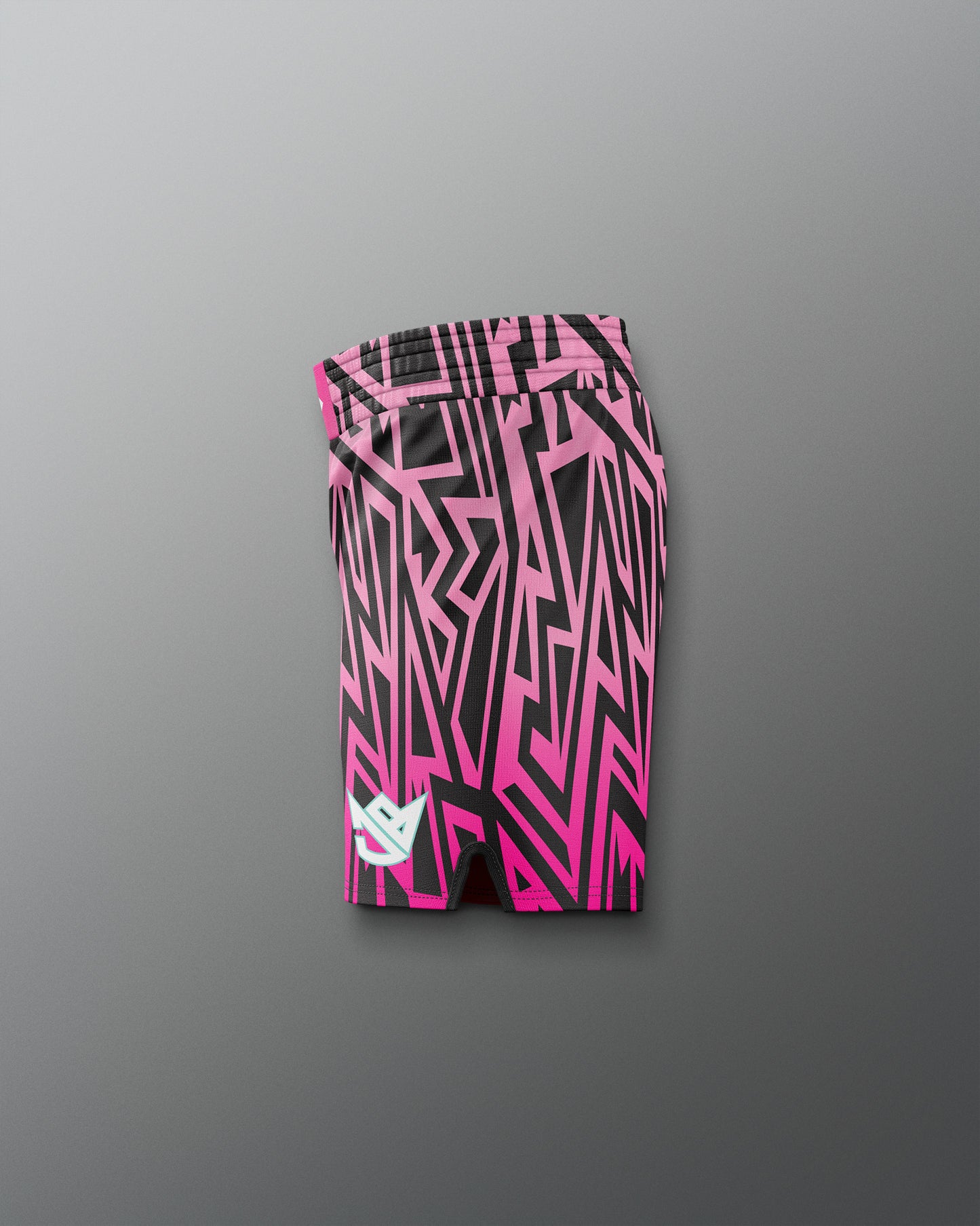 Pink and black patterned shorts on a gray background