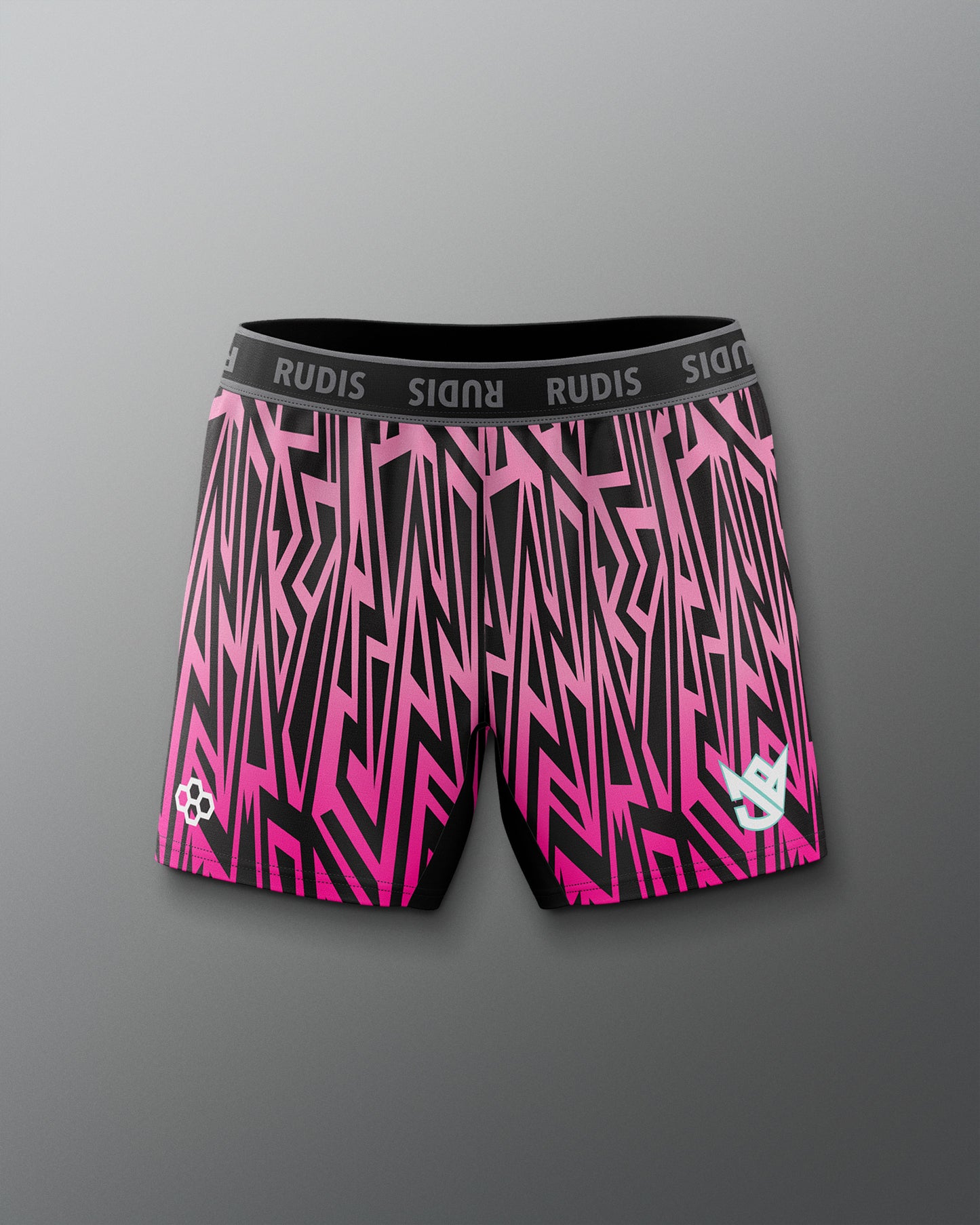 Pink and black patterned shorts with 'RUDIS' branding on a gray background
