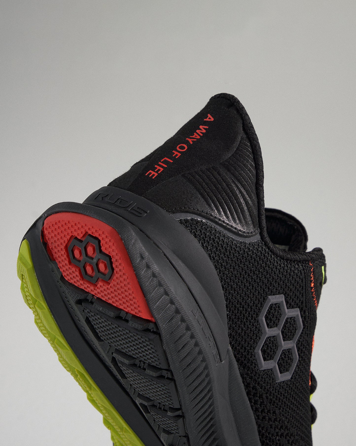 A close-up view of a black athletic shoe showcasing its modern design featuring a breathable upper colorful accents and a durable sole for performance