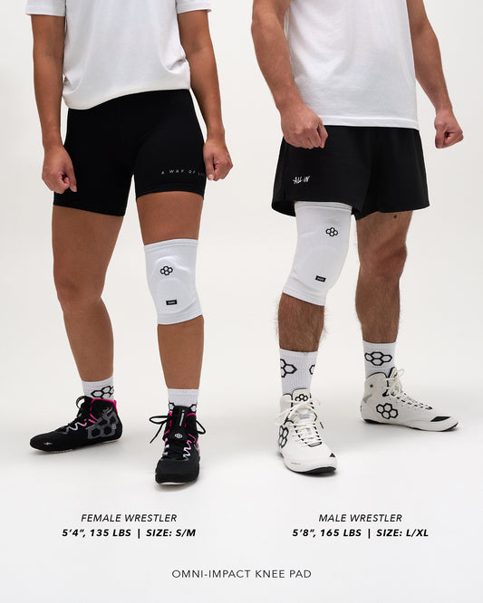 RUDIS Omni-Impact White Wrestling Knee Pad size comparison on female wrestler 5'4", 135 lbs wearing S/M and male wrestler 5'8", 165 lbs wearing L/XL.