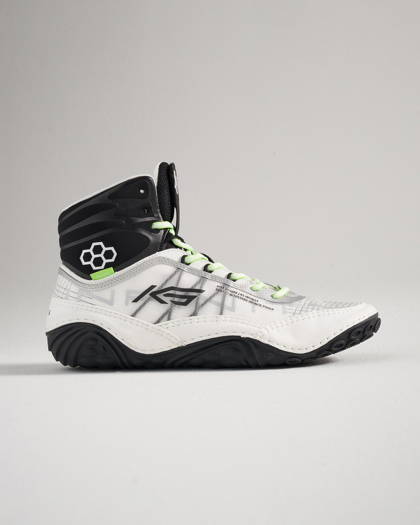 A stylish high-top athletic shoe featuring a mix of white and black colors with vibrant green laces and a textured sole for enhanced performance