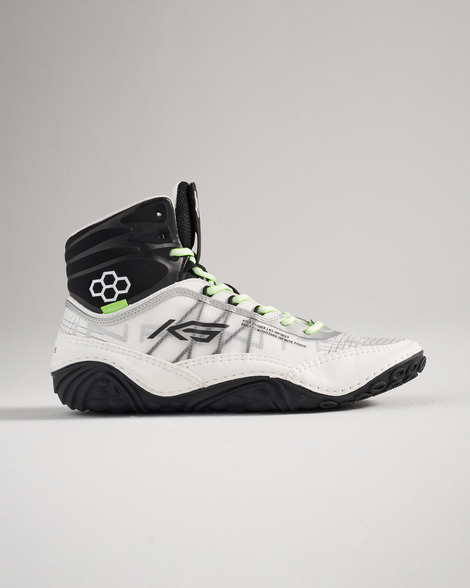 A stylish high-top athletic shoe featuring a mix of white and black colors with vibrant green laces and a textured sole for enhanced performance