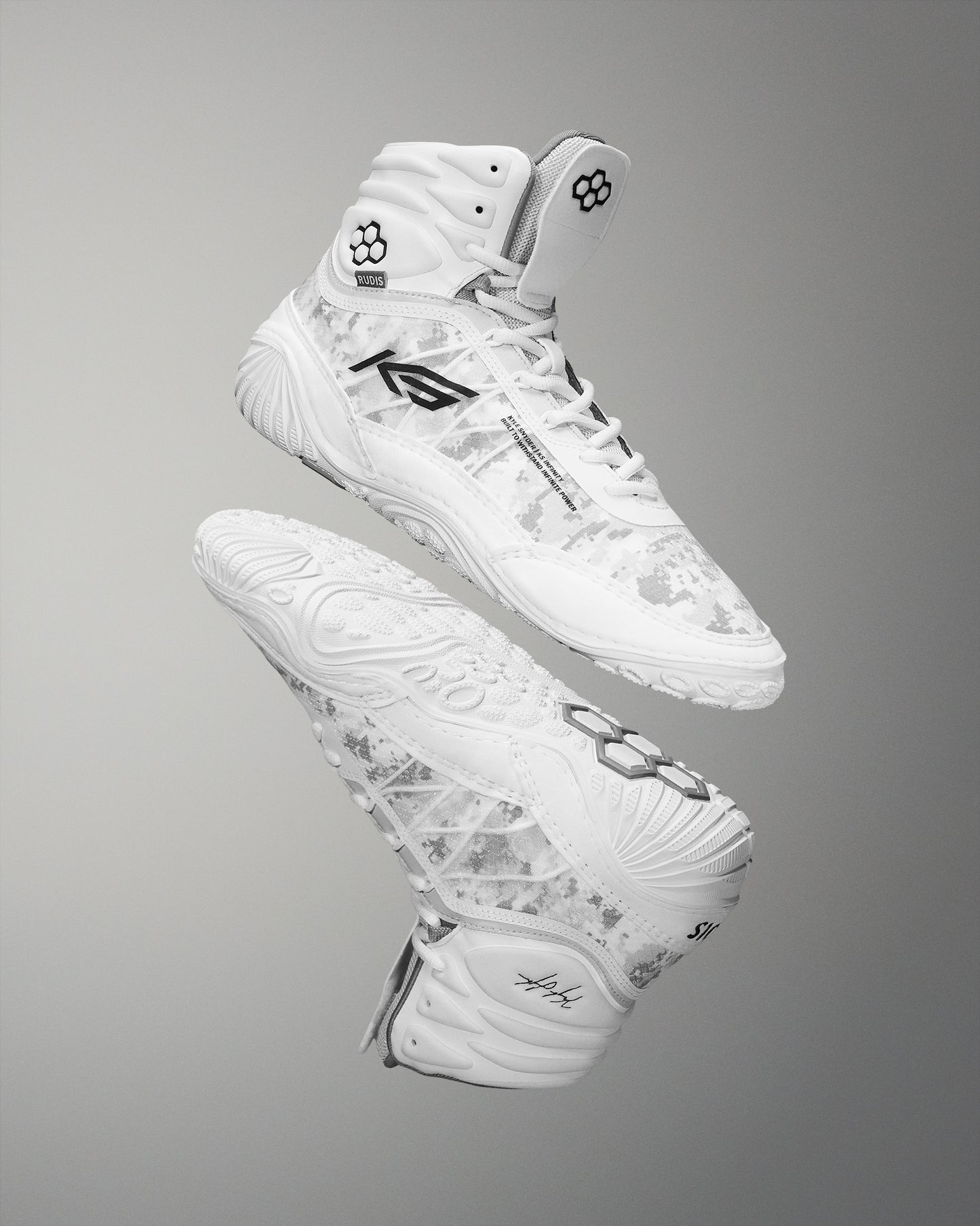 High-top wrestling shoe in white, featuring a camouflage pattern and a textured sole for traction, highlighted against a soft gray background.