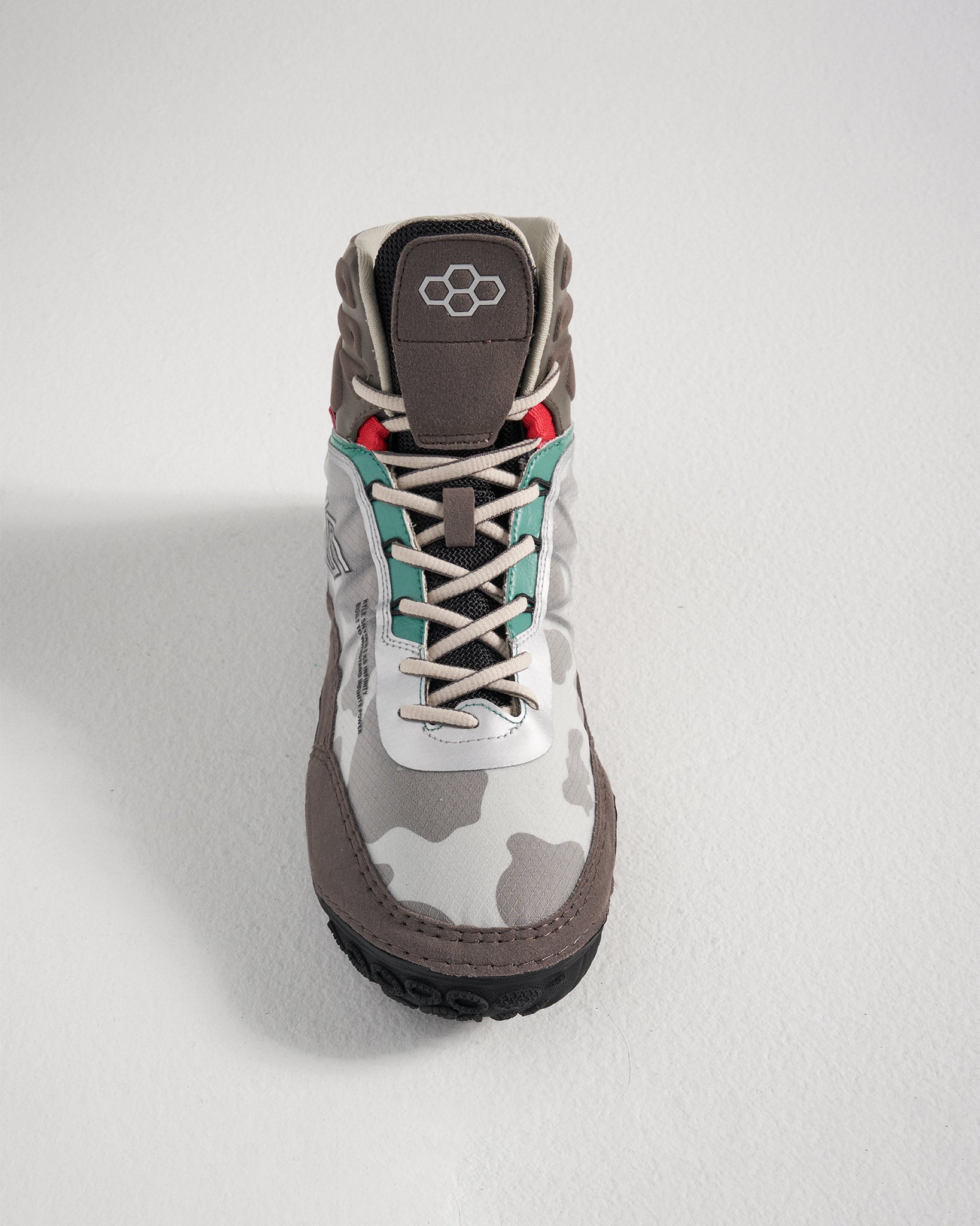 A stylish gray and white camouflage boot with colorful accents and sturdy construction highlighting a blend of modern design and functional features