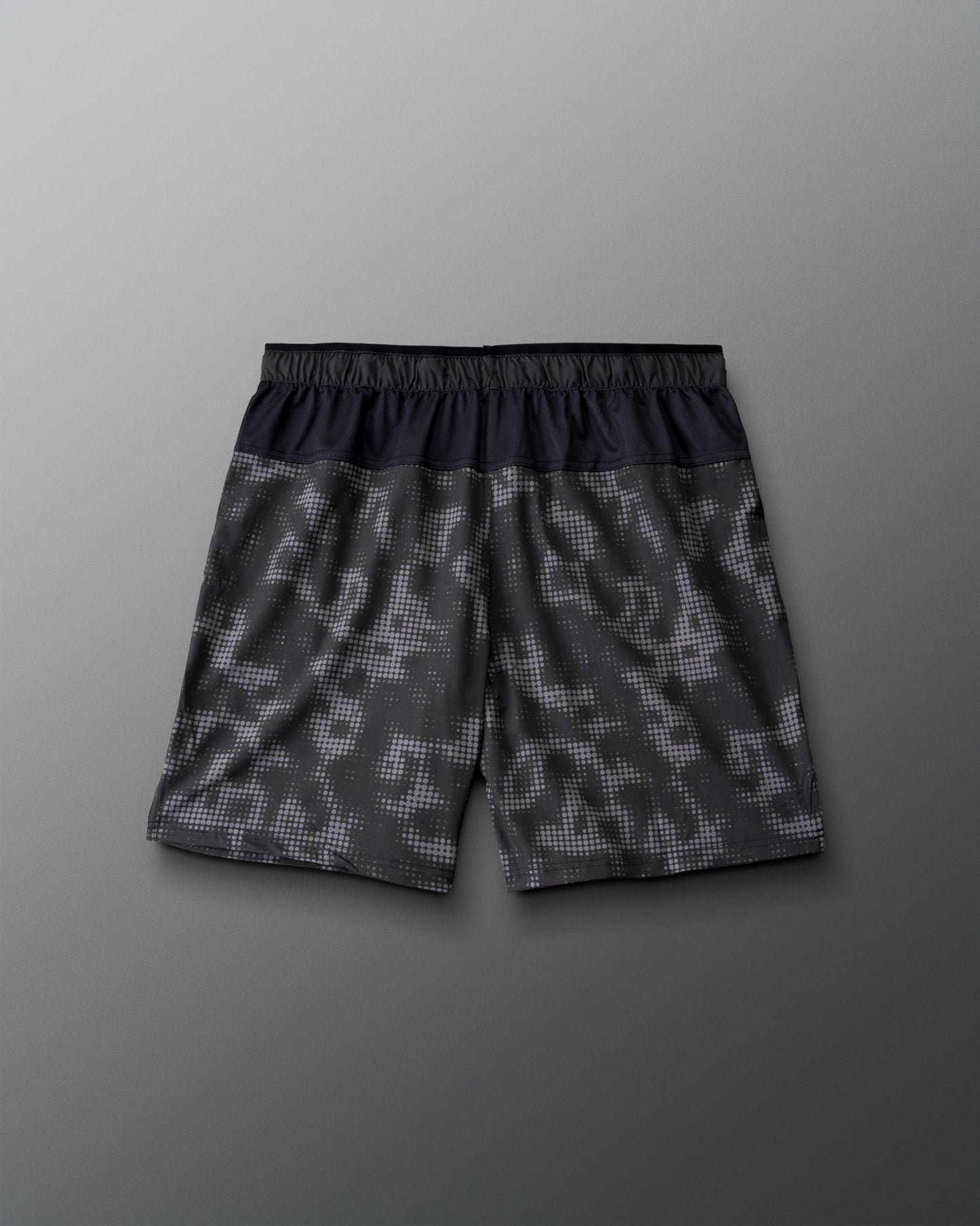 RUDIS Resolute Attack lacrosse shorts in black with a tonal camo print, featuring an elastic waistband, side pockets, Rocket logo on the left leg, and RUDIS logo on the right leg.