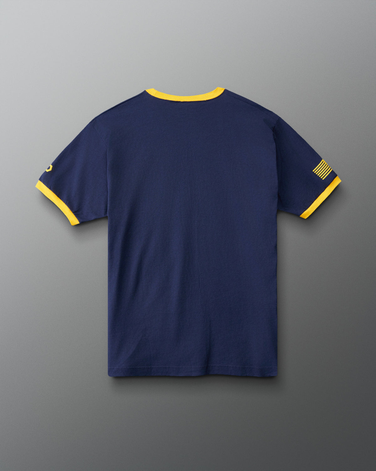 RUDIS U.S. Navy Ringer T-Shirt in Navy/Yellow, back view showing solid navy fabric, contrasting yellow collar and sleeve trim, and military-inspired sleeve graphics.