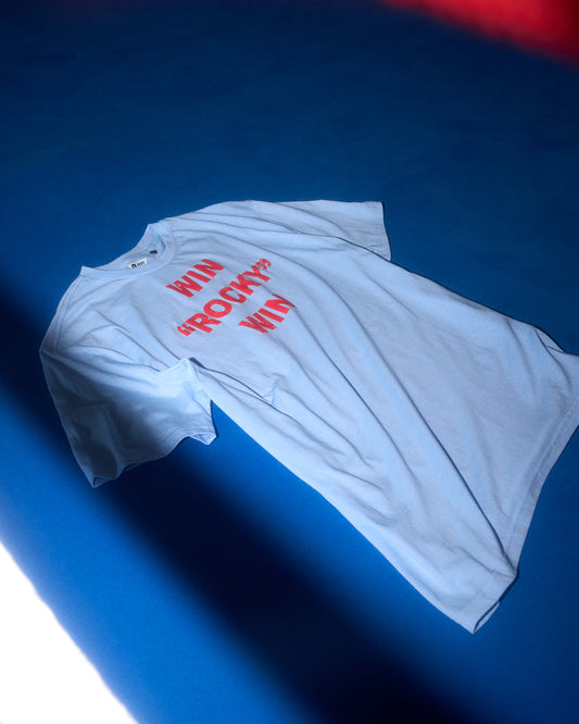 Blue t-shirt with red text on a blue background