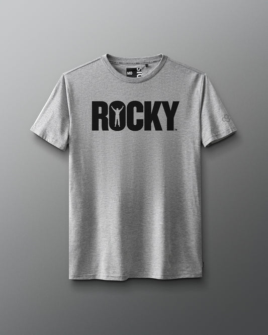 Front view of a gray T-shirt featuring the classic black 'ROCKY' logo across the chest, with the silhouette of a victorious boxer inside the letter 'O,' inspired by the original Rocky movie.
