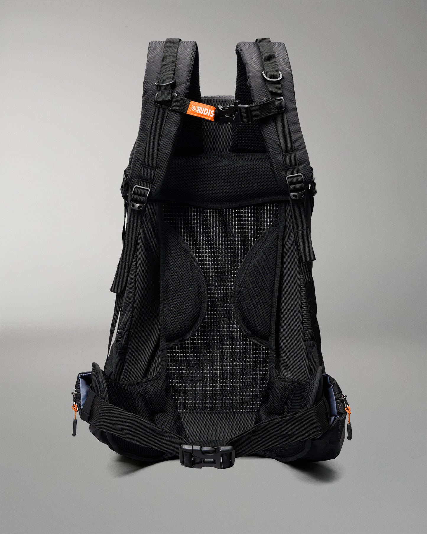 The back view of a black PRO2000 hiking backpack, showing the breathable mesh back panel, padded shoulder straps, and side compression buckles against a neutral gray background.