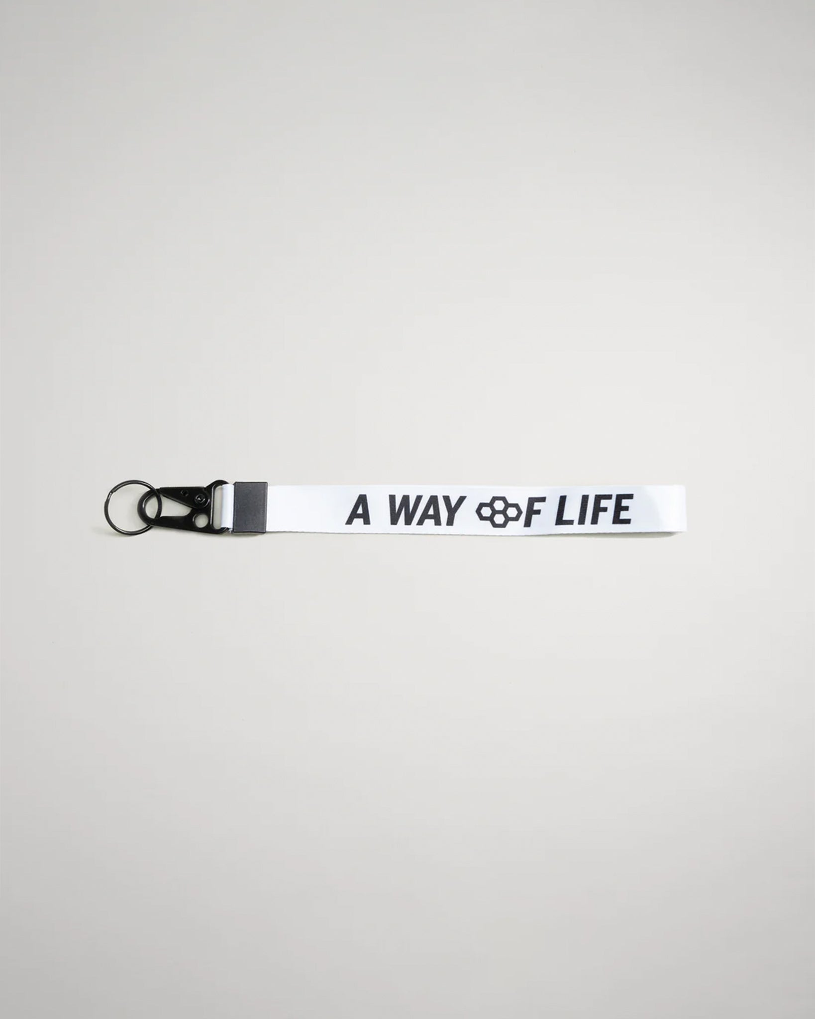 This image features a white lanyard with the text A WAY OF LIFE printed in bold black letters accompanied by a black clip and ring attachment for convenience