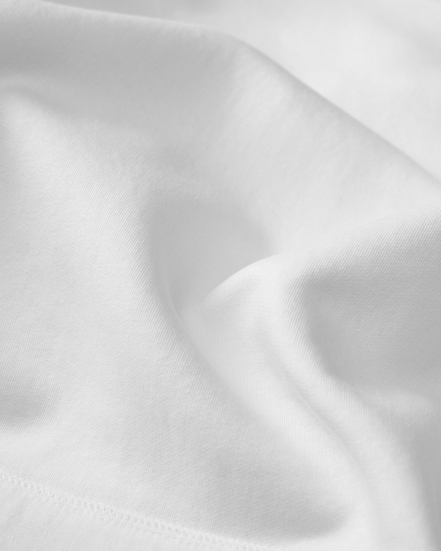 Close-up of white fabric with subtle texture