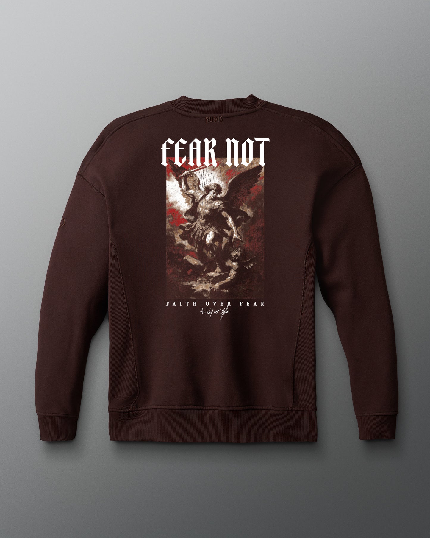 Brown sweatshirt with graphic design and text on a gray background