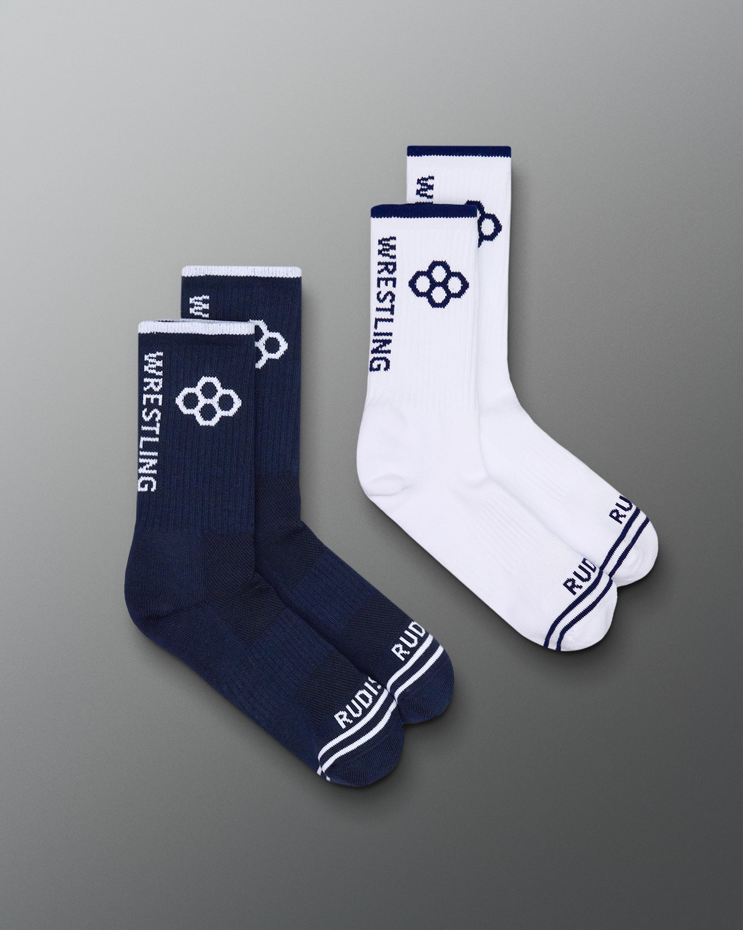 Pair of navy and white wrestling socks on a gray background