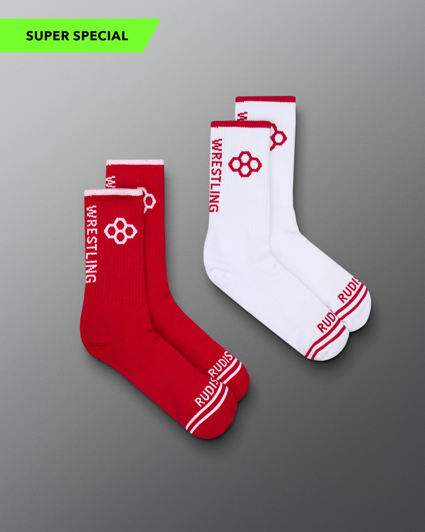 Red and white wrestling socks with visible branding on a gray background