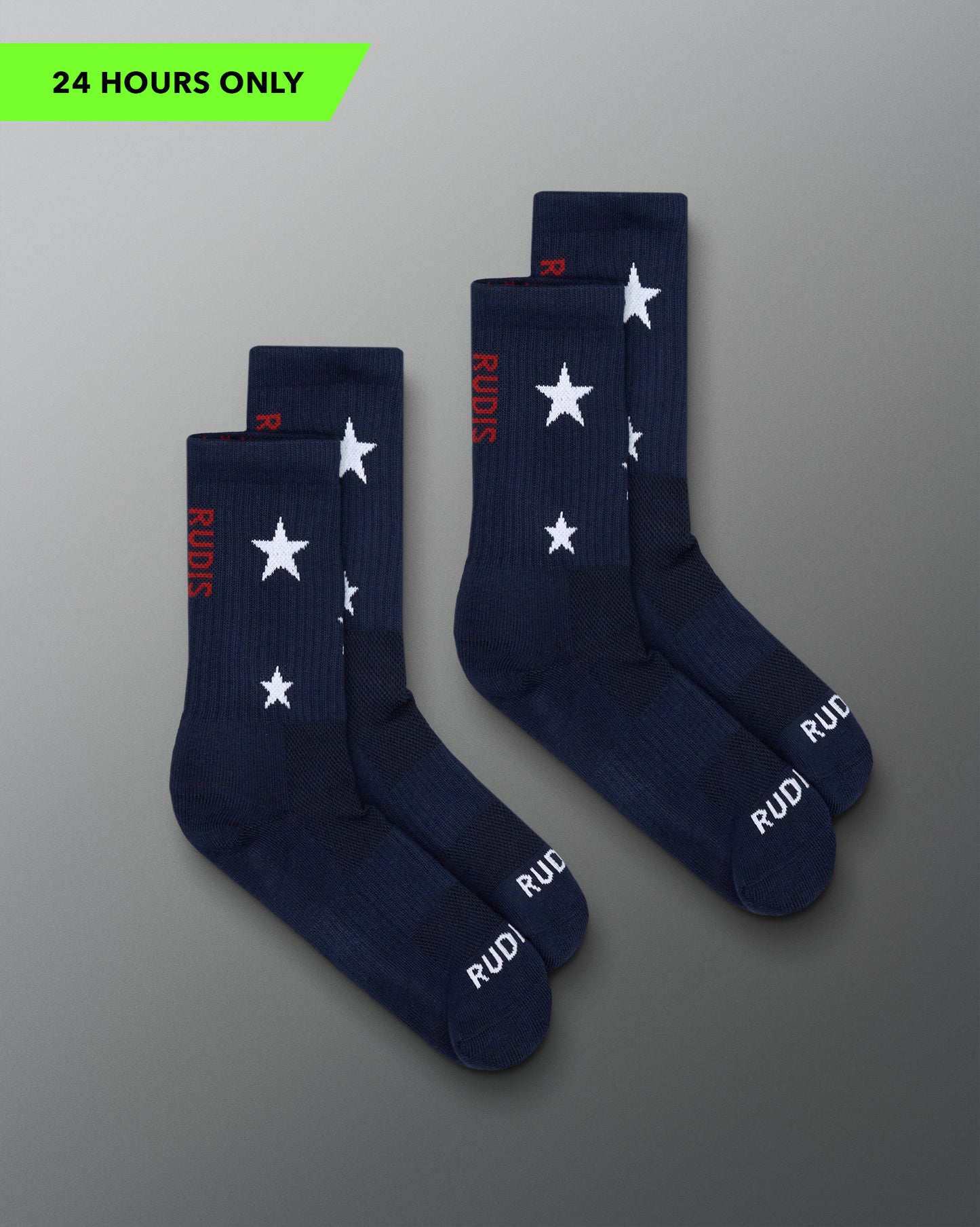 Navy socks with white star patterns and red text on a gray background