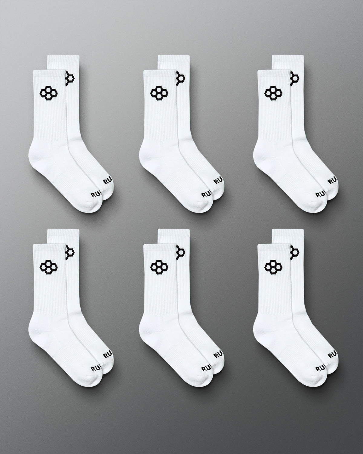 RUDIS Essential Hex Cushion Crew Socks 6-pack in white, featuring black RUDIS Hex logos at the crew and RUDIS branding at the toe.