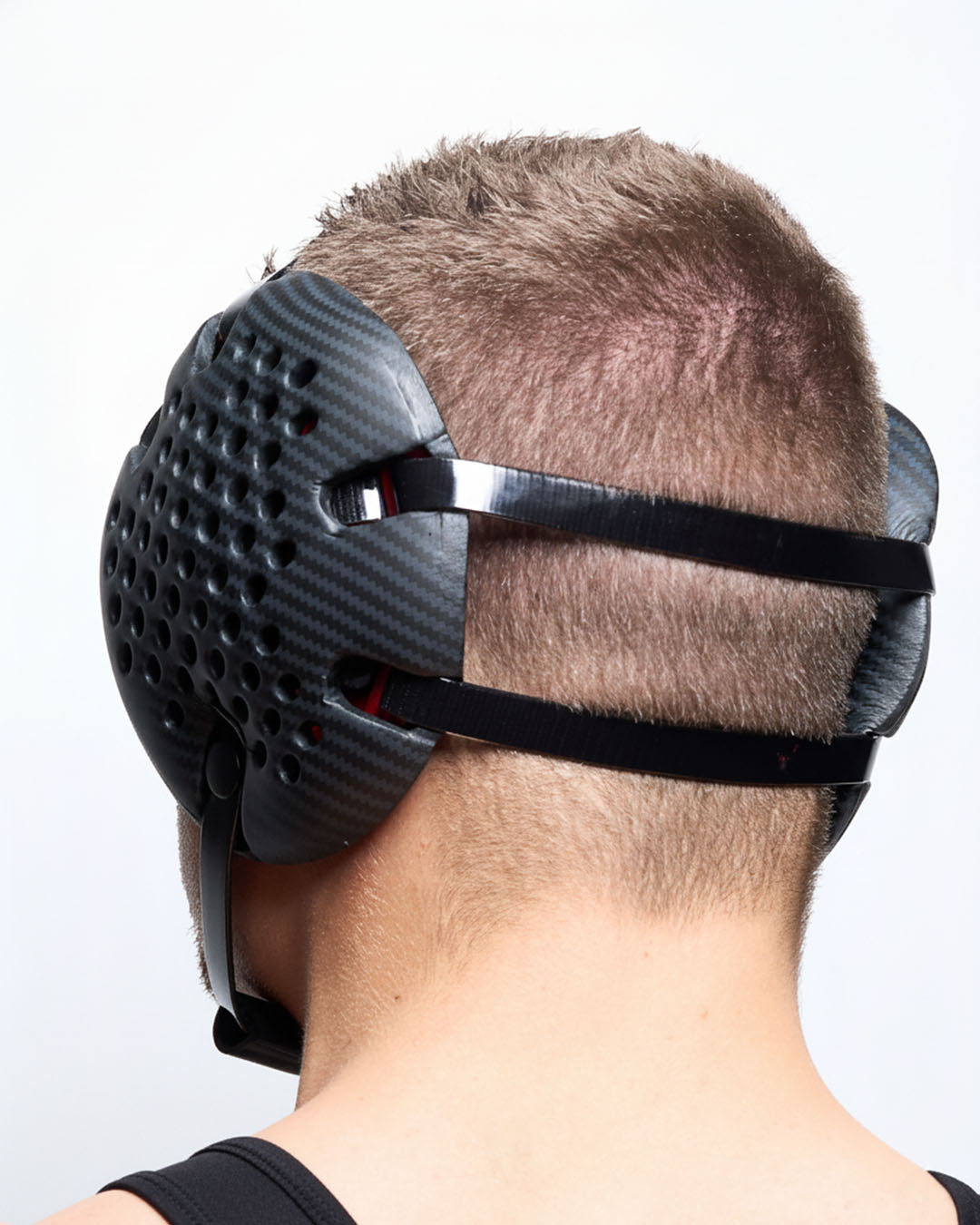 Person wearing black RUDIS Airflow wrestling headgear ear protection