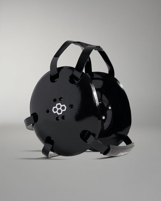 Black wrestling headgear on a gray background