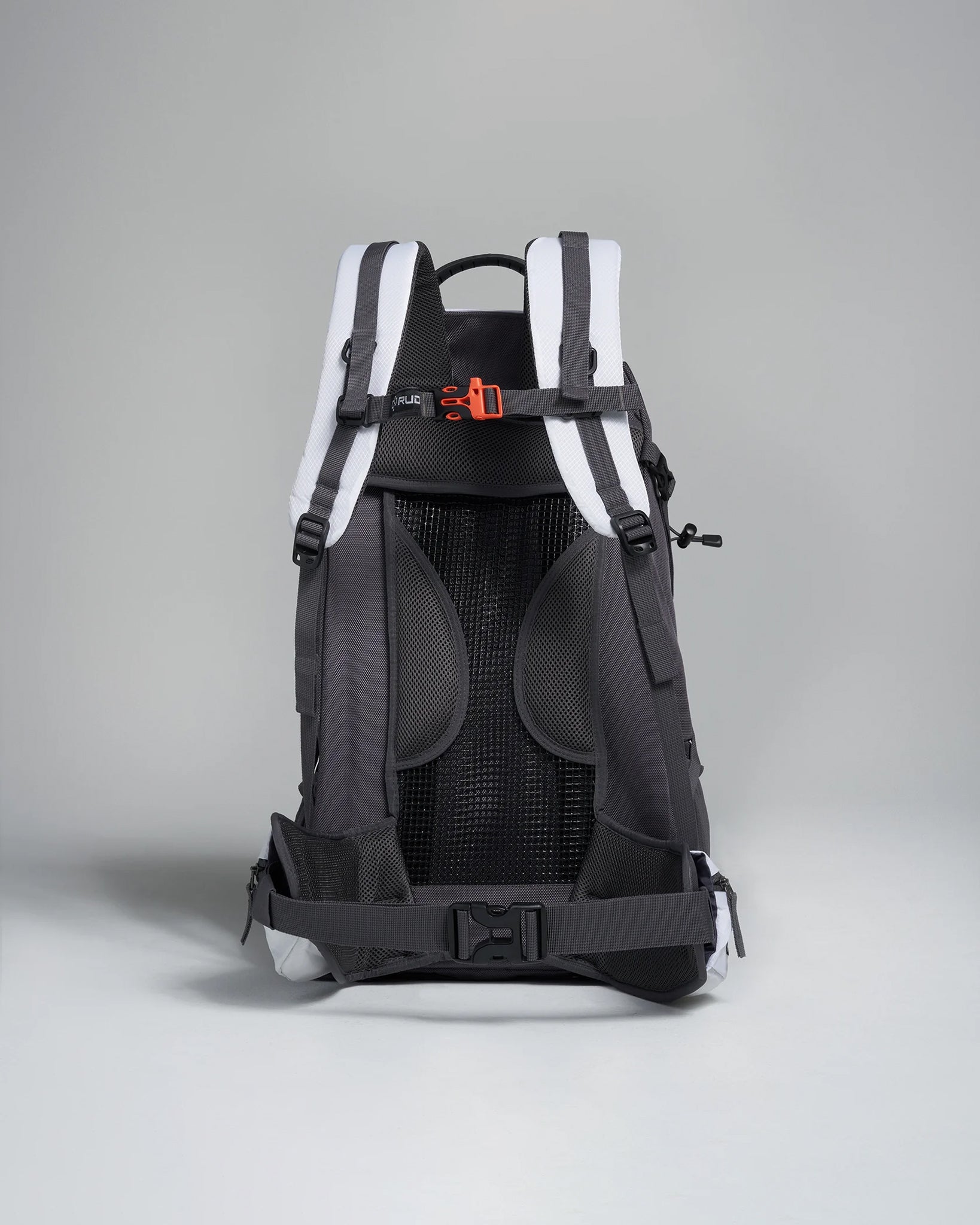 A sleek backpack featuring a dark design with white accents and ergonomic back support suitable for hiking or daily use