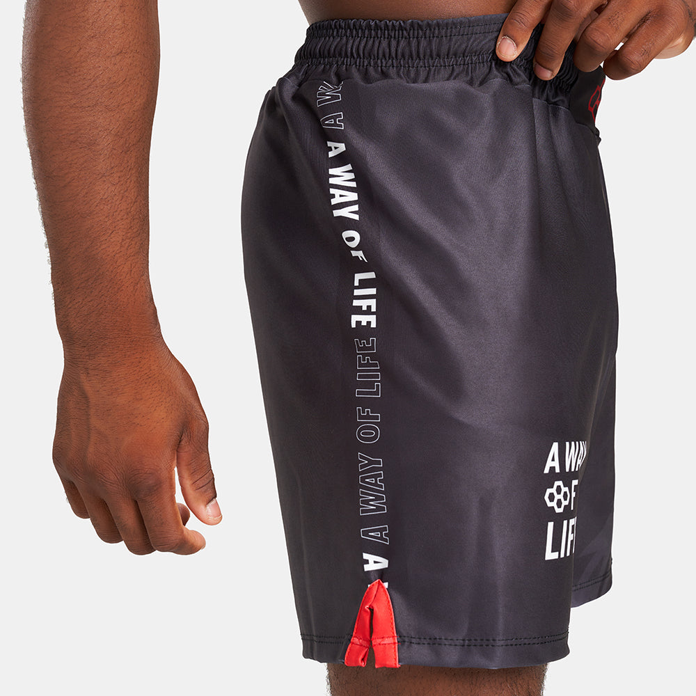 Stylish black athletic shorts featuring bold white text and vibrant red accents ideal for active wear