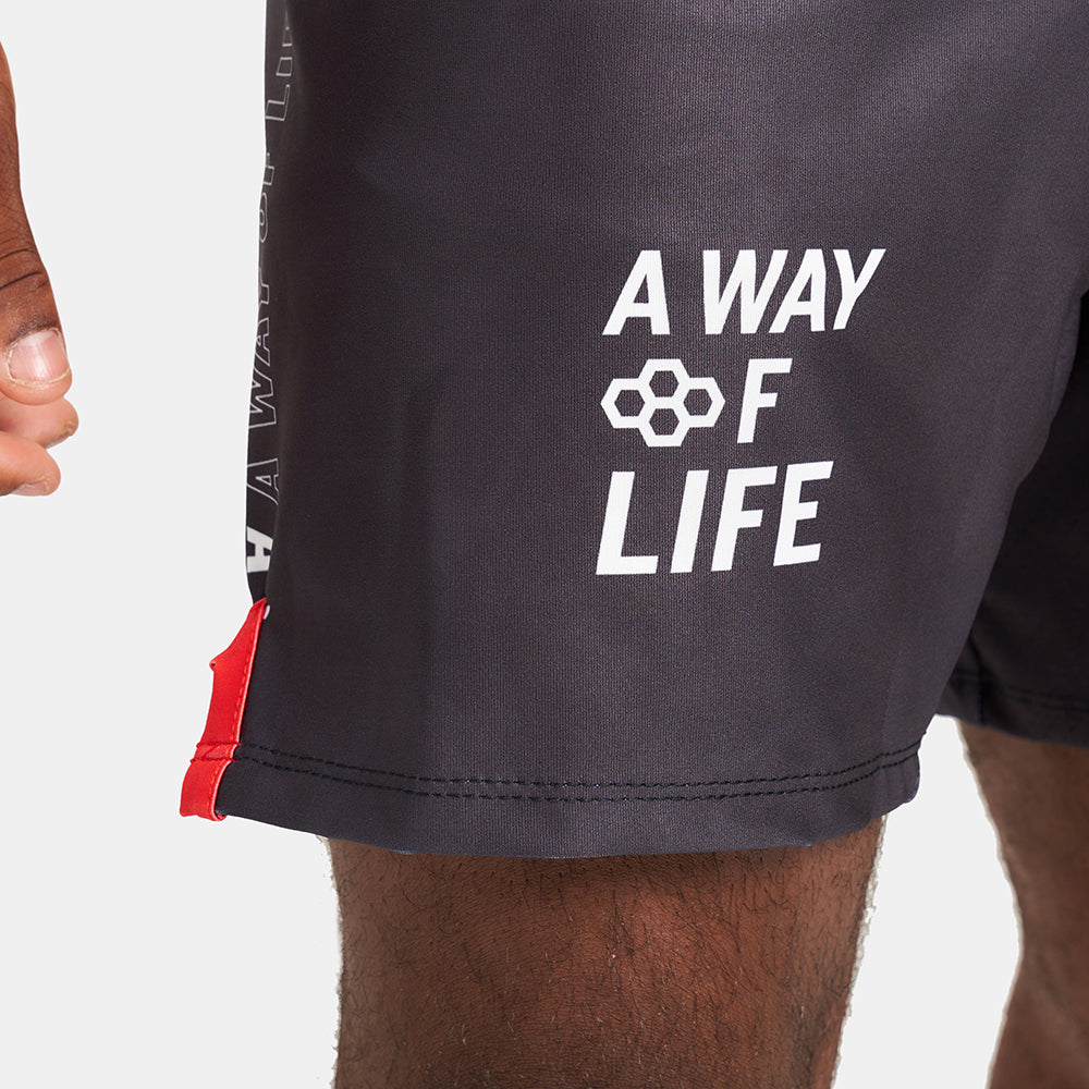 Black athletic shorts featuring the phrase A WAY OF LIFE in bold white letters and a red accent at the bottom