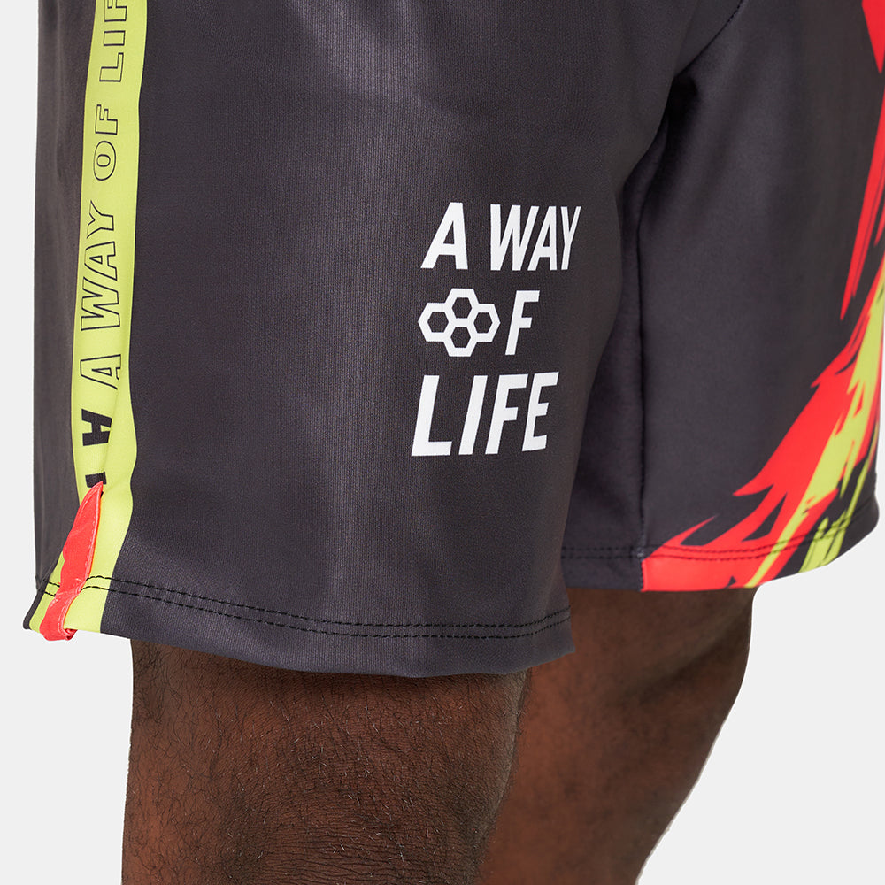 Stylish athletic shorts featuring a bold design with vibrant colors and motivational text