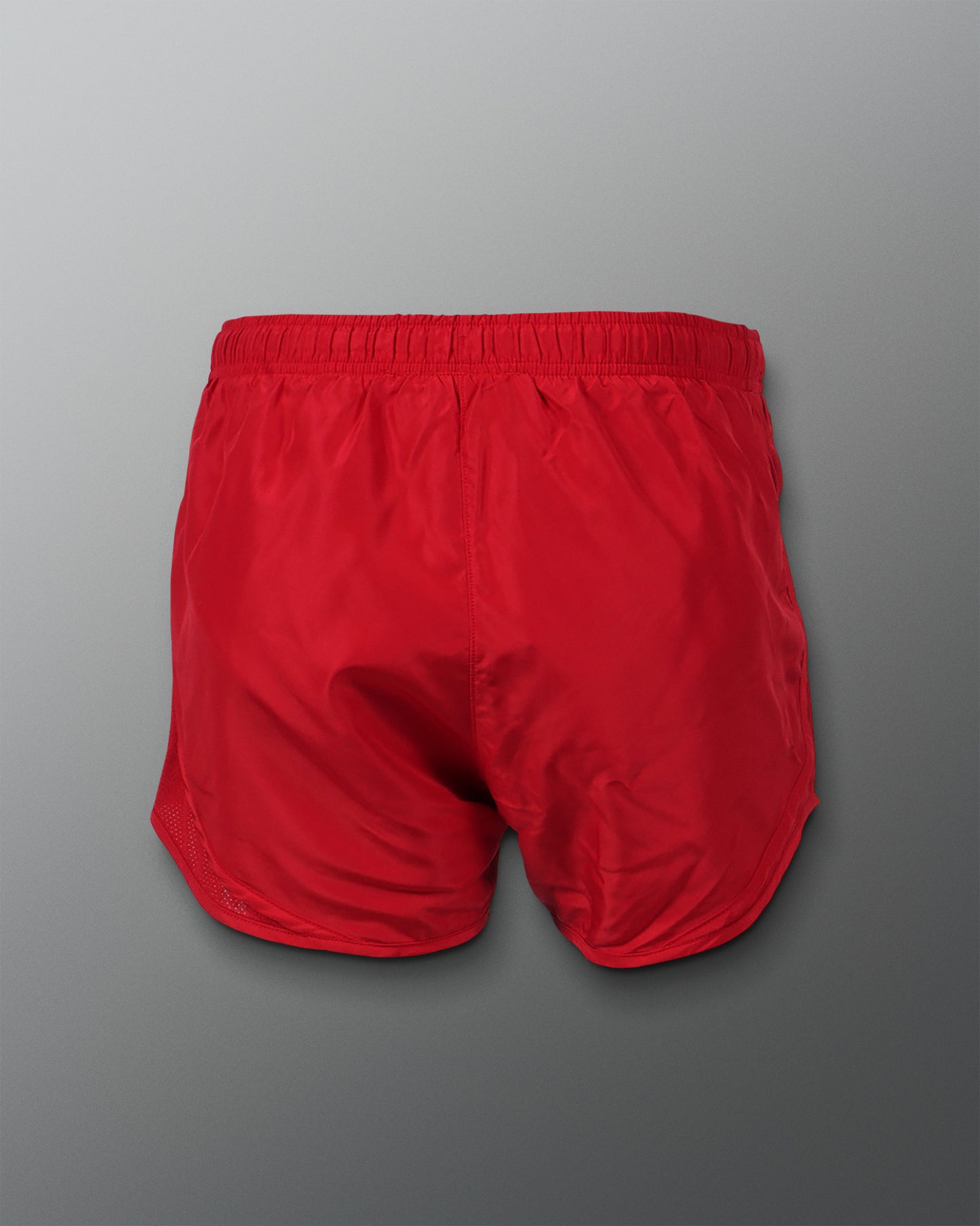 A pair of vibrant red athletic shorts featuring a simple design and elastic waistband suitable for sports and casual wear