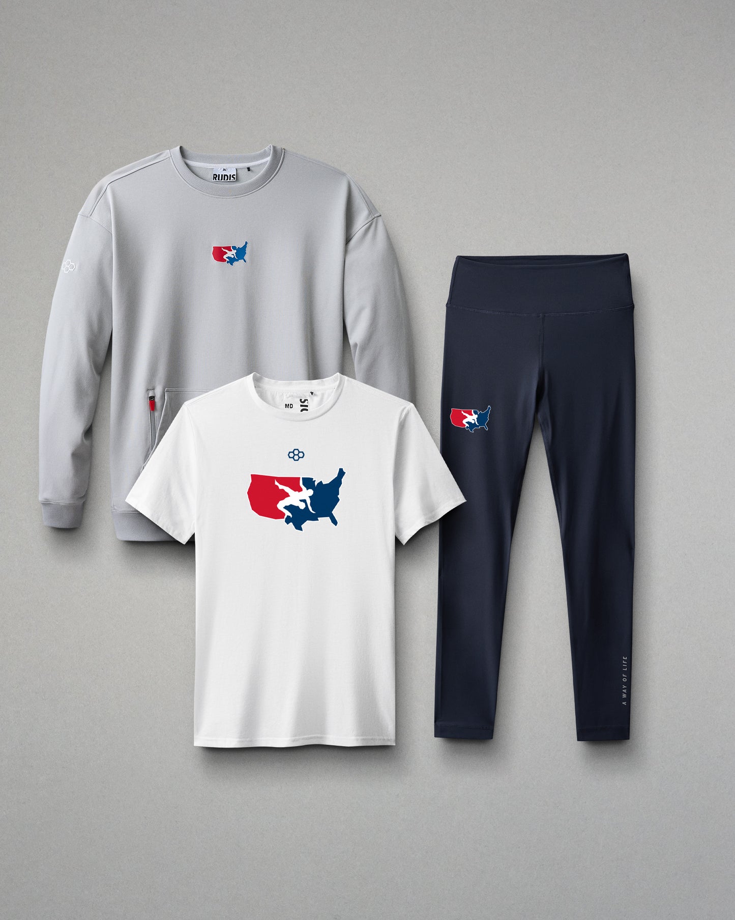 Gray sweatshirt, white t-shirt, and black leggings with a logo on a gray background