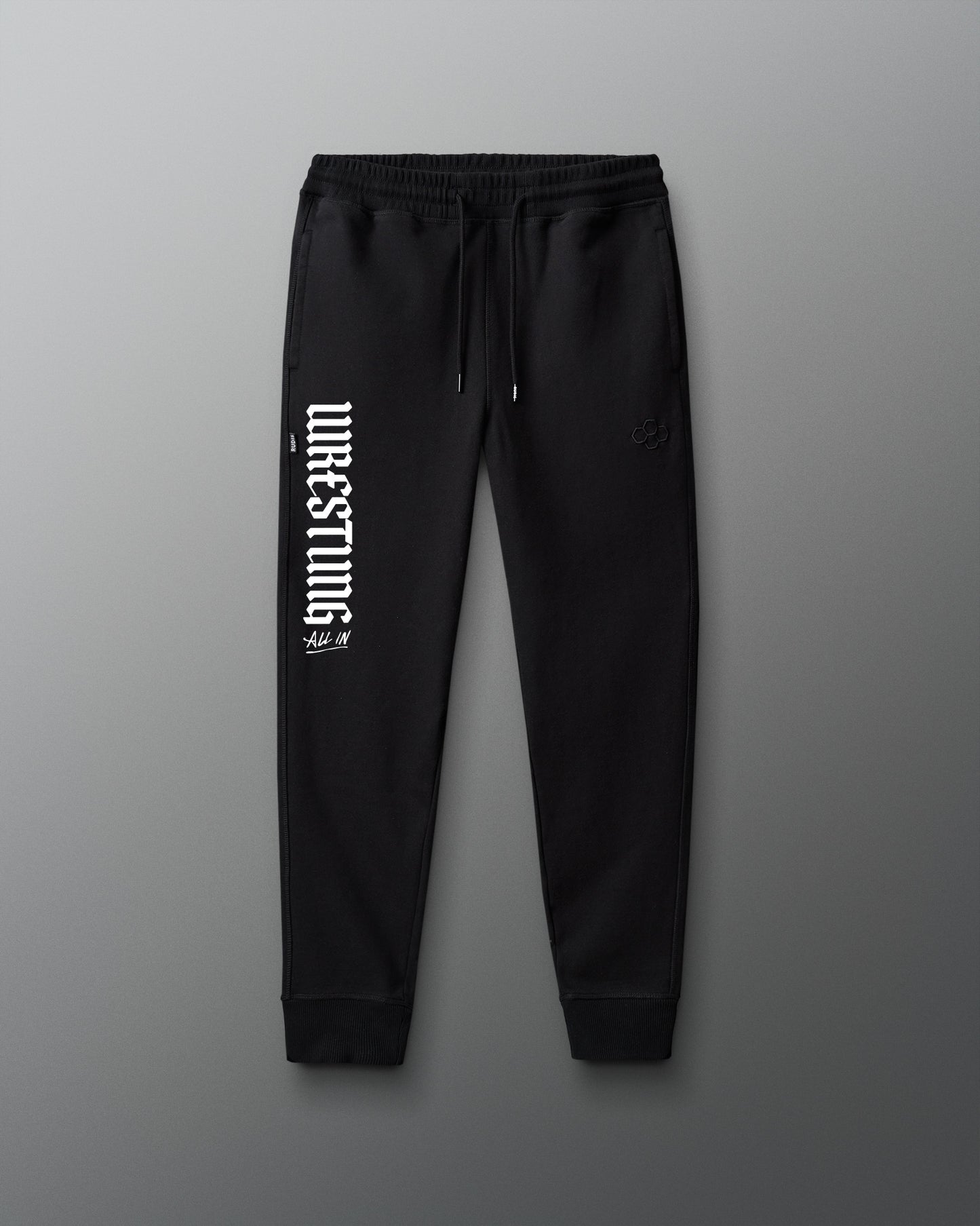 Black sweatpants with white text on a gray background