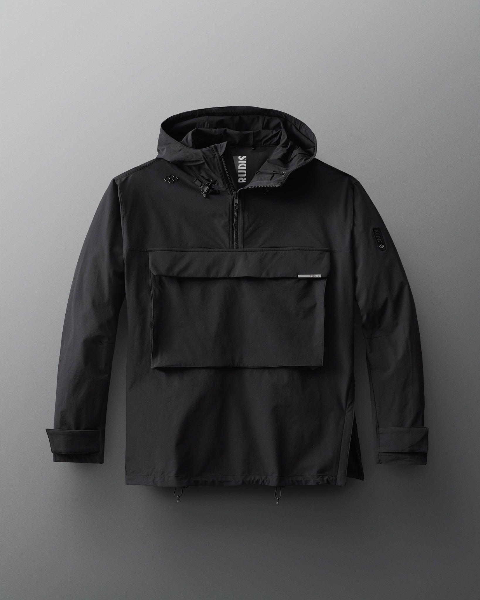 A black 1/4 zip windbreaker jacket with a hood and front gear pocket.