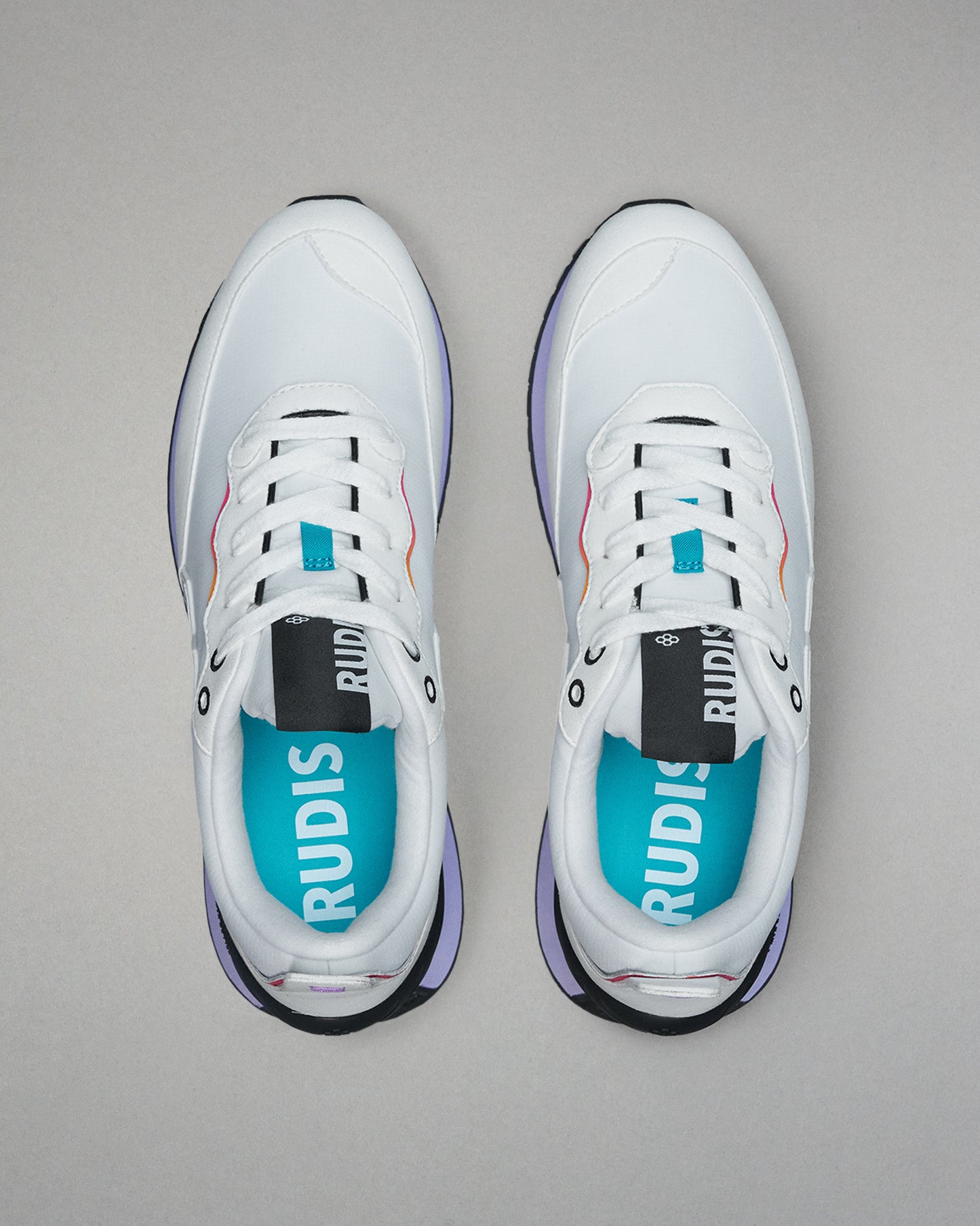 White sneakers with blue accents on a gray background