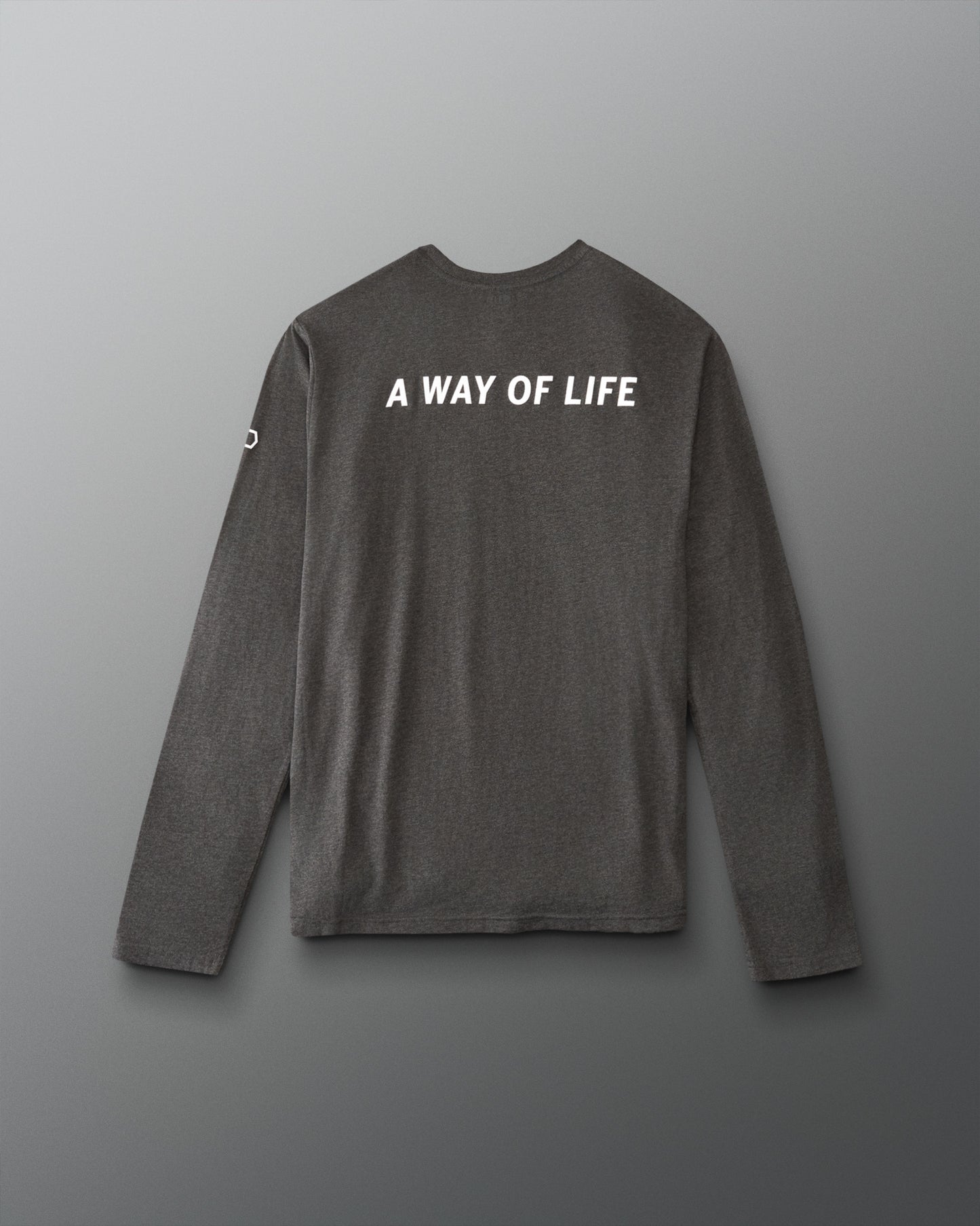 A dark gray long-sleeve t-shirt with 'A WAY OF LIFE' printed in white capital letters across the upper back, displayed against a neutral gray background.